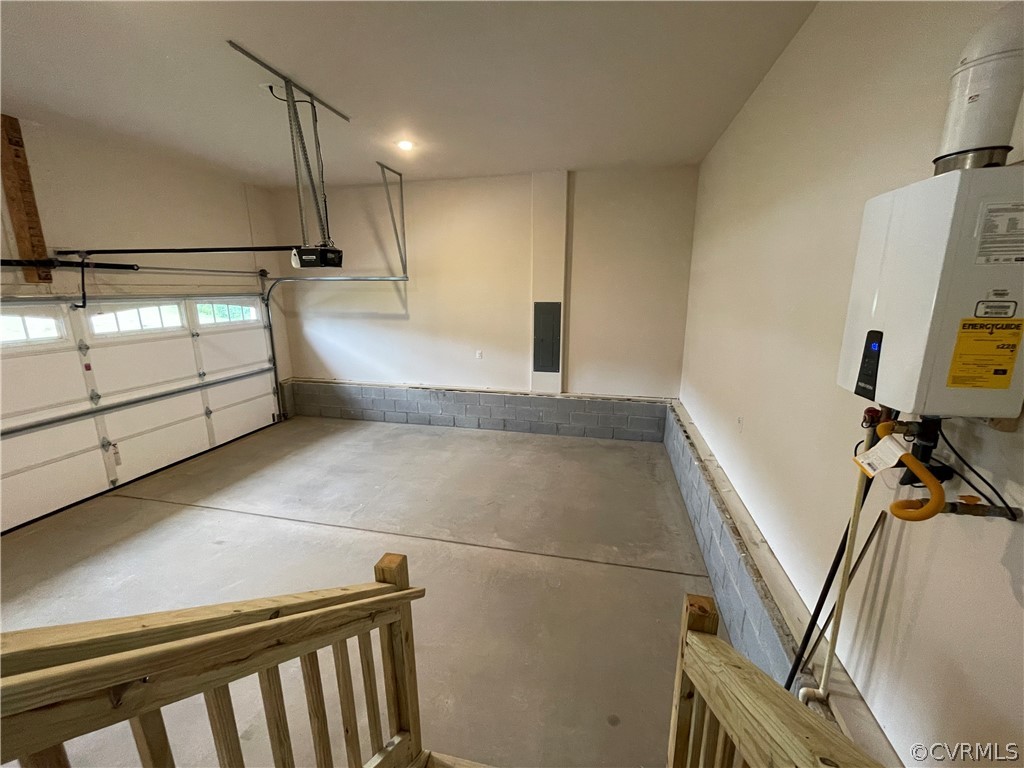 Garage with water heater and a garage door opener