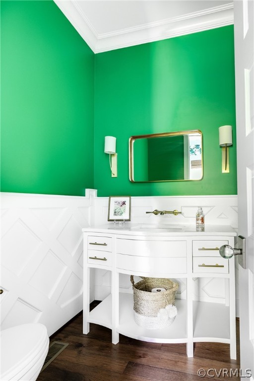 The half bath is discretely tucked away and has lovely trim detailing.