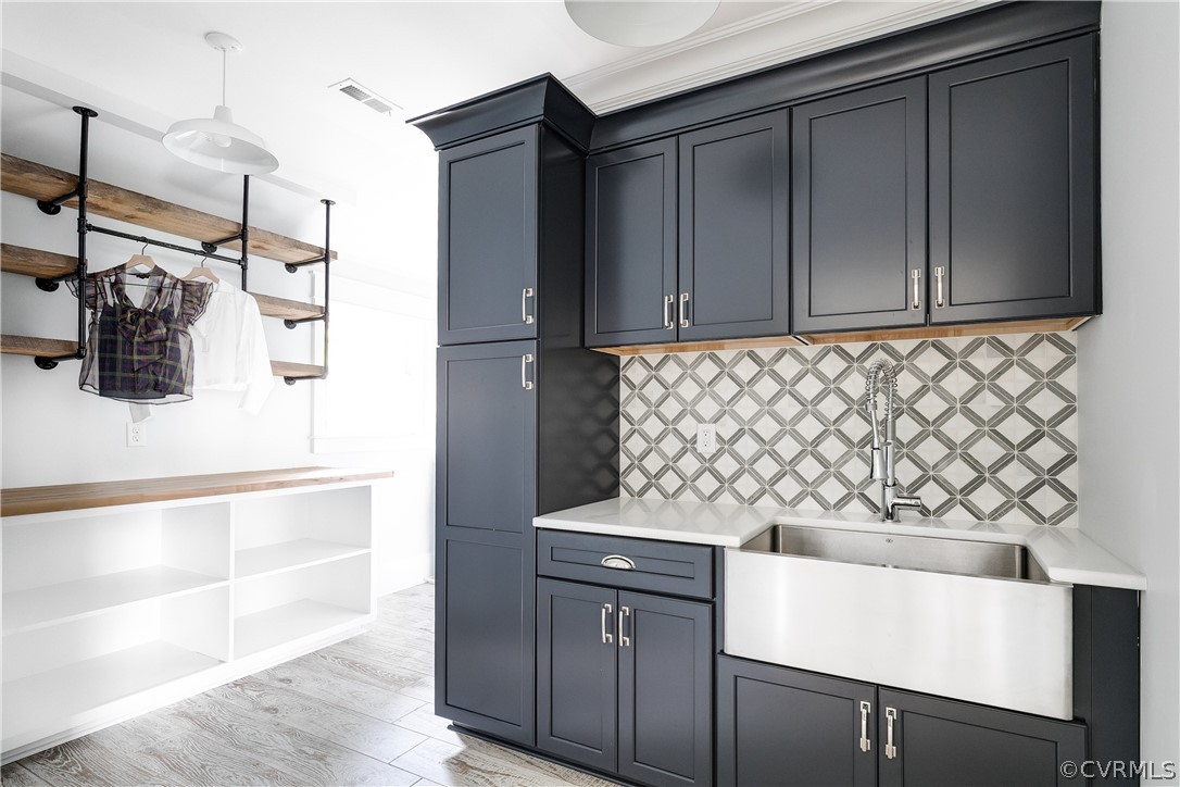 If laundry could be a dream, THIS is where it would start! Awesome cabinetry, fantastic tile, beautiful built-ins...It's a great place to hideaway!