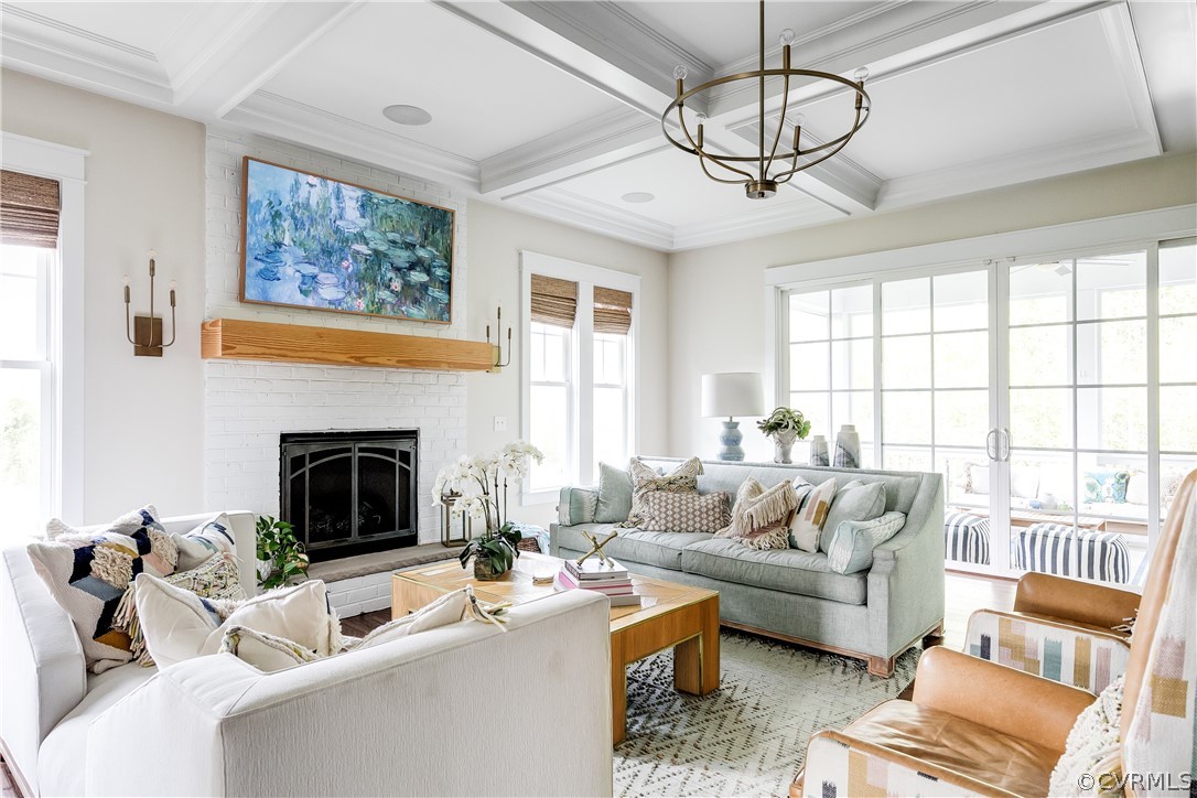 A graceful family room features a brick gas fireplace as the focal point.
