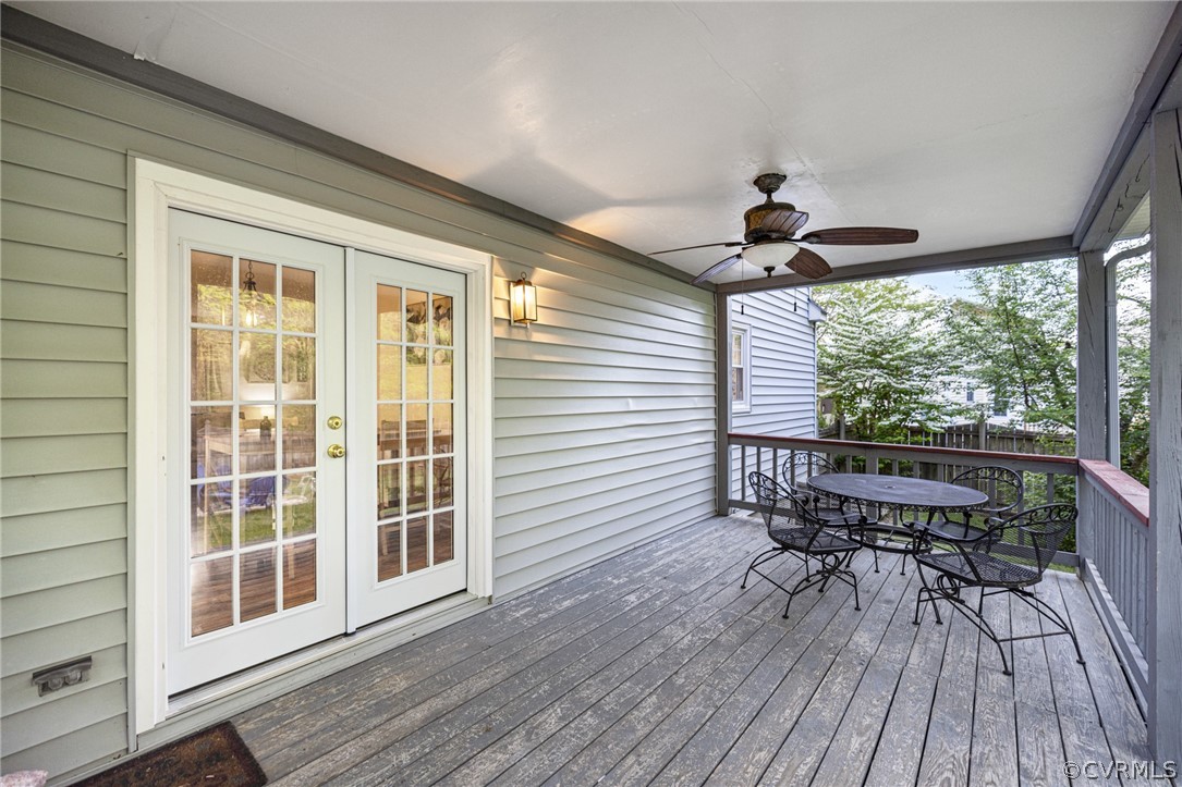 Deck with french doors and ceiling fan