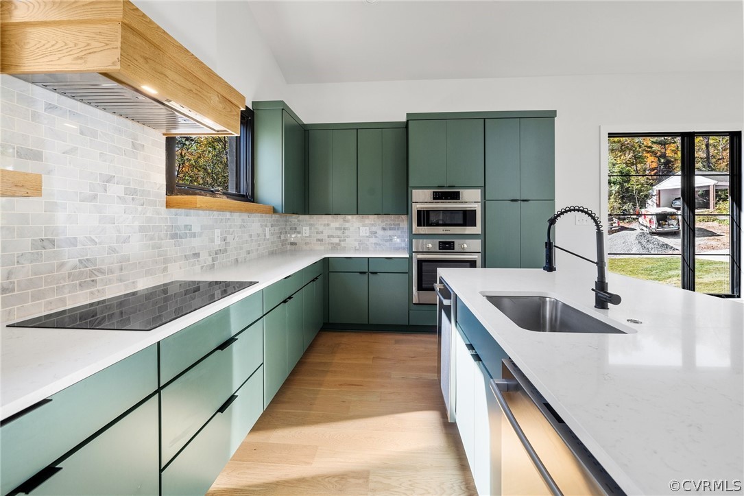 Kitchen features contemporary cabinet pulls, single bowl sink, backsplash and induction cooking
*All photos represent a similar home by the same builder, Center Creek Homes*