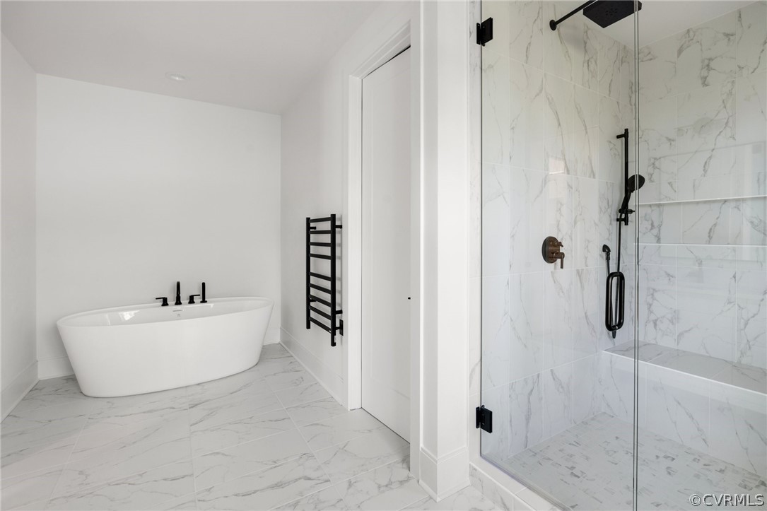 Primary bathroom features free-standing soaking tob and walk in shower
*All photos represent a similar home by the same builder, Center Creek Homes*