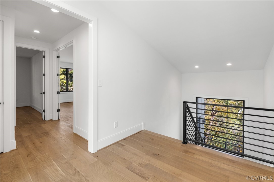 Upstairs landing featuring vaulted ceiling and white oak flooring *All photos represent a similar home by the same builder, Center Creek​​‌​​​​‌​​‌‌​‌‌​​​‌‌​‌​‌​‌​​​‌​​ Homes*