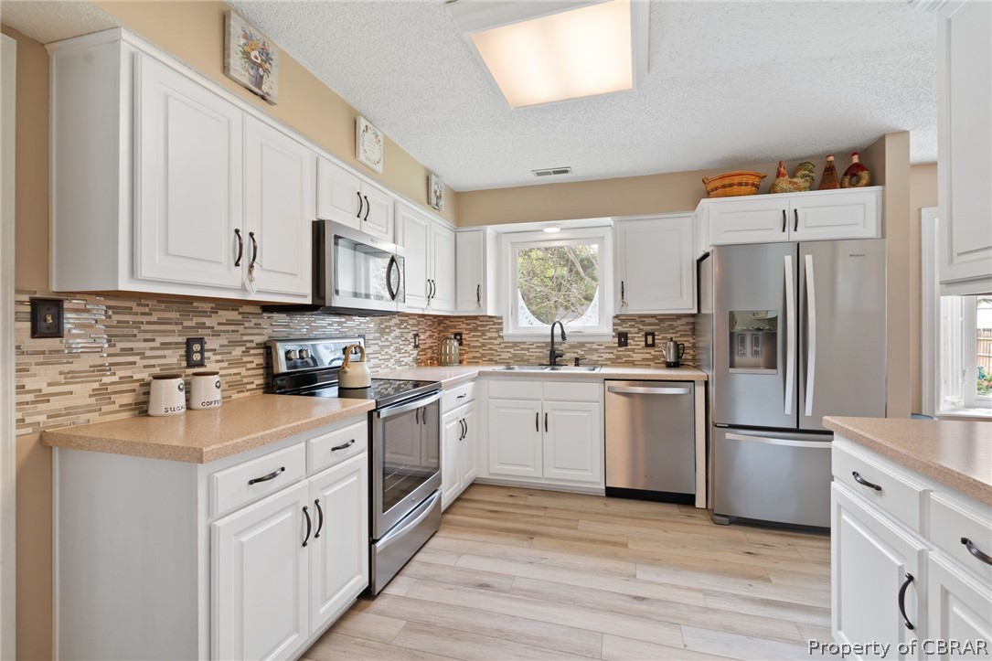 Kitchen featuring appliances with stainless steel appliances.
