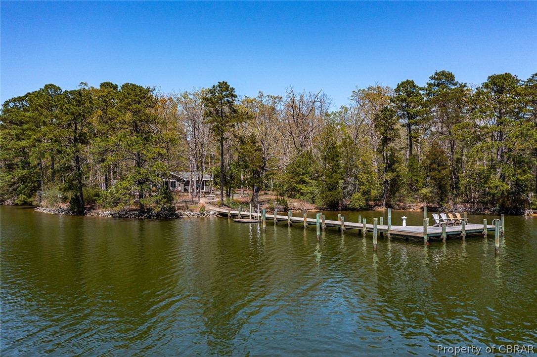 Property view of water featuring a boat dock