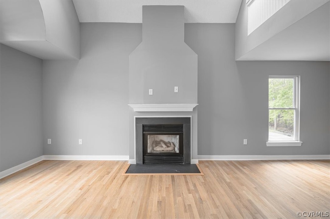 Unfurnished living room featuring light hardwood / wood-style flooring