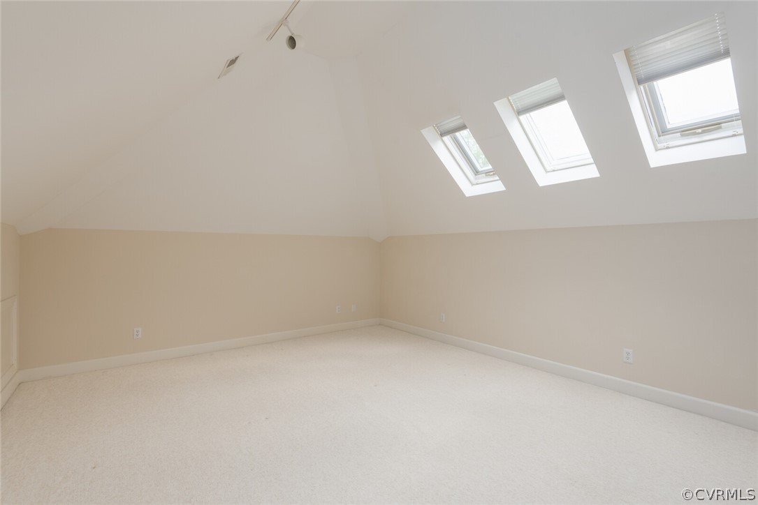 Large Upstairs Bedroom with Skylights