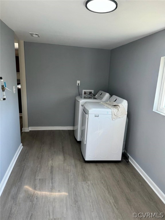 Washroom featuring hookup for a washing machine, hardwood / wood-style flooring, and washer and clothes dryer