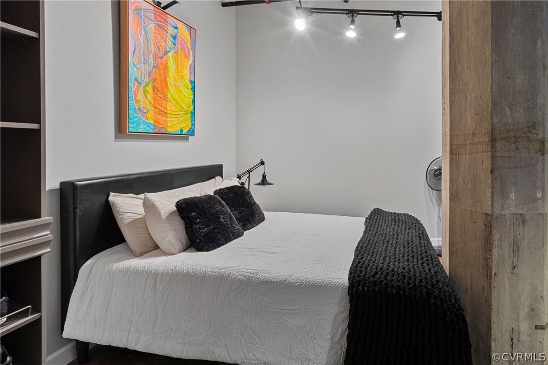 Bedroom featuring rail lighting