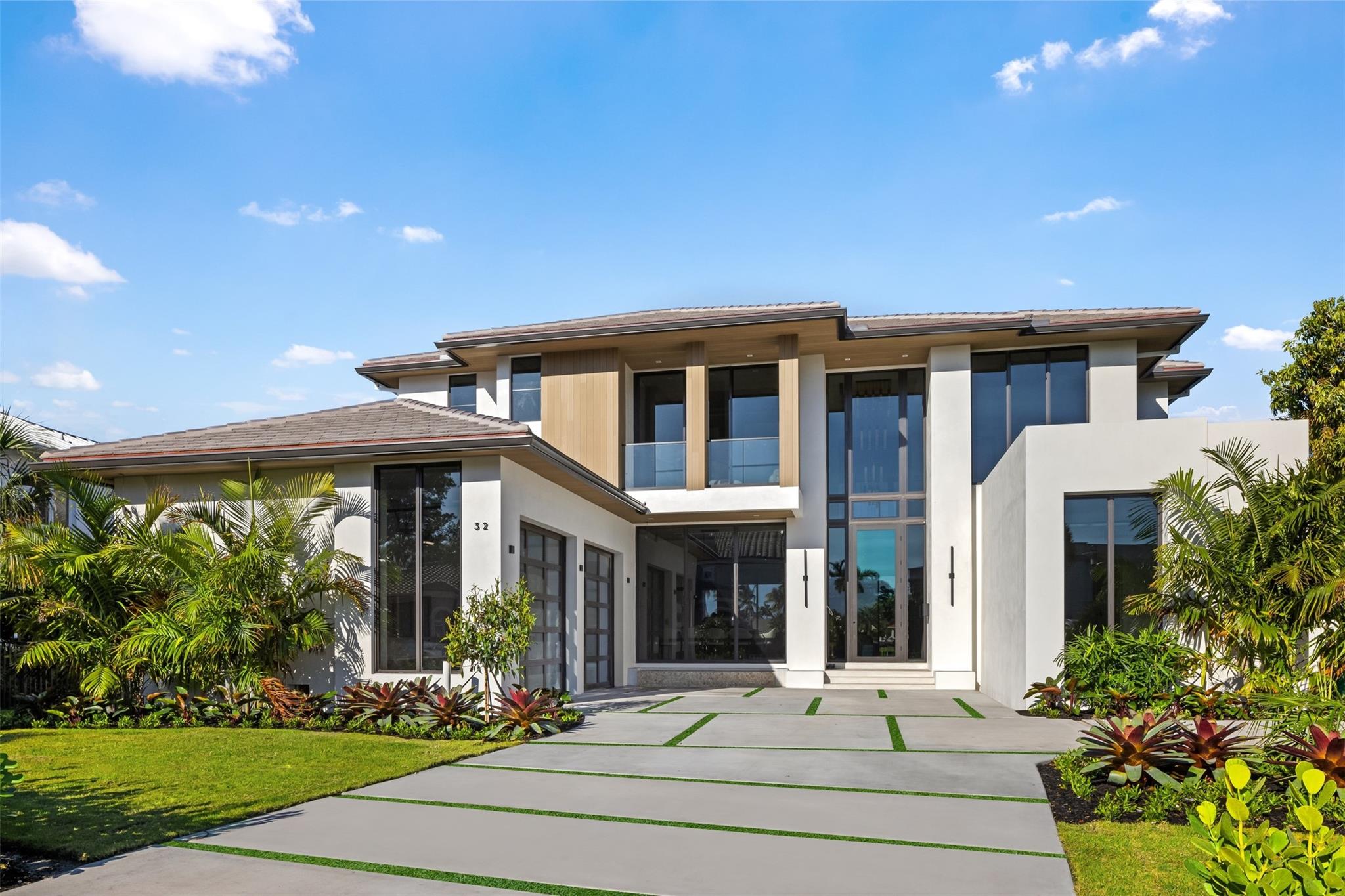 This Intracoastal estate in prestigious Sea Ranch Lakes is a masterpiece of ultra-luxe design. Gated w/its own police force, private Beach Club & private beach access. Developed by Beth Geduld Holdings, this extraordinary 9200 total sq ft home integrates indoor/outdoor living w/sliding glass walls, east & west light filled views, intracoastal breezes & expansive balconies. This turnkey home w/110’ of waterfront features elegant millwork, multiple entertaining/dining areas, refrigerated wine display, infinity pool, outdoor cabana. Primary bedroom features separate bathrooms & an outdoor shower on terrace. Additional features include elevator, clubroom, 3-car garage, boat dock, generator ready & lush landscaping. Located minutes from prestigious Pine Crest School. Expected completion 1/25.