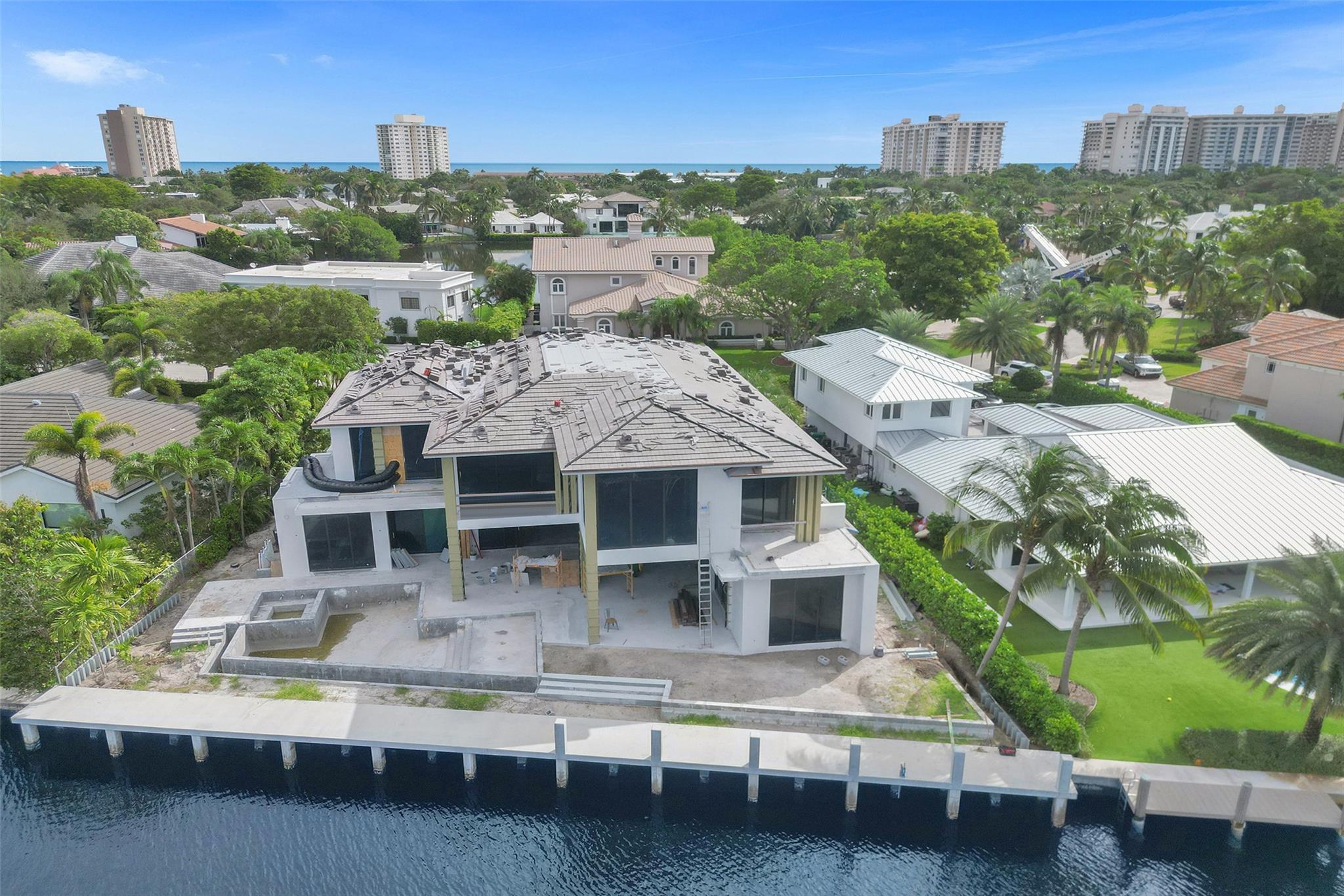 This Intracoastal estate in prestigious Sea Ranch Lakes is a masterpiece of ultra-luxe design. Gated w/its own police force, private Beach Club & private beach access. Designed by Randall Stoffts, this extraordinary 9200 total sq ft home integrates indoor/outdoor living w/sliding glass walls, east & west light filled views, intracoastal breezes & expansive balconies. This turnkey home w/110’ of waterfront features elegant millwork, multiple entertaining/dining areas, refrigerated wine display, infinity pool, outdoor cabana. Primary bedroom features separate bathrooms & an outdoor shower on terrace. Additional features include elevator, clubroom, 3-car garage, boat dock, generator & lush landscaping. Located minutes from the Prestigious Pine Crest School. Expected completion 2024.