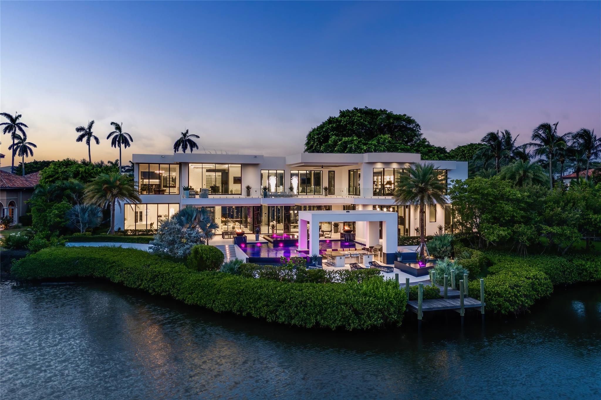 110 Churchill Way is a luxurious waterfront estate offering a luxurious living experience. This exclusive property is located on a coveted island in Palm Beach County and boasts 250 linear feet of waterfront, providing breathtaking views of the Intracoastal Waterway.

The estate spans over 15,303 square feet of living space and includes 6 bedrooms and 8 full bathrooms. It features three state-of-the-art kitchens, a movie theater, a fitness room, a cigar lounge, a private salon, and six distinct bar areas.

Outdoor amenities include a majestic pool area with fire bowls, a covered pavilion, a grand gazebo, and a fully equipped summer kitchen. The property also comes with exclusive membership to the Eau Palm Beach Resort & Spa, enhancing its resort-style living appeal.