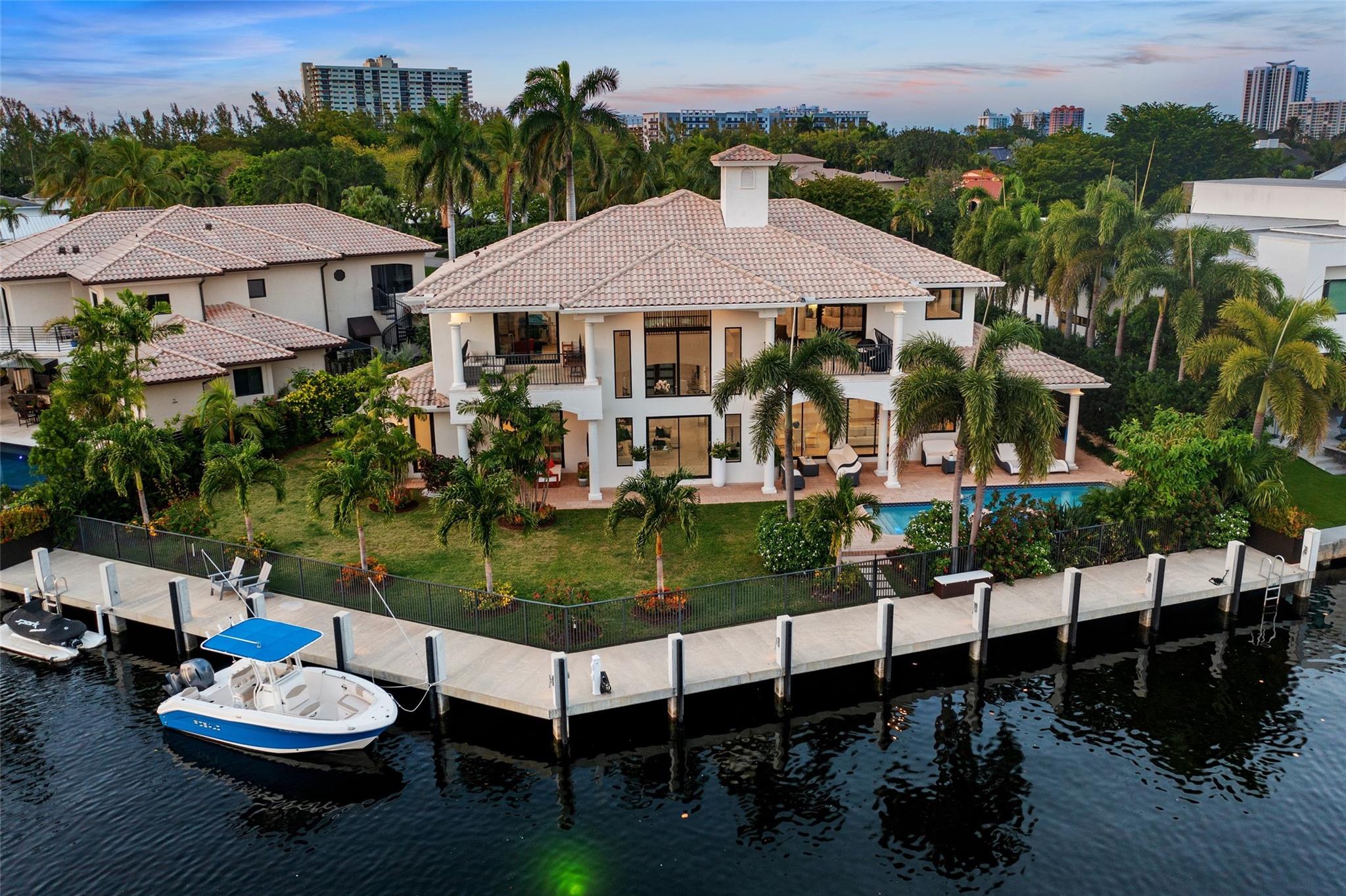 Bay Colony: Fort Laud Premier 24 Hour Armed Gated Community | 5-Minute Drive to Pine Crest School | 0.30± Acres on Non-Traffic Cul-De-Sac Circle | Yachtsmen: 140± Ft No Fixed Bridge Deepwater Fits Multiple Watercraft | Wide Cap Batter Pile Seawall | 8 Ft Wide Wrap Concrete Dock has Water & Power | 32 Ft Heated Pool with Spa | 3-Car Garage with Interlock Flooring | Ample Yard For Playground & Pets | Hurricane Impact Glass | Covered Loggia with Summer Kitchen | Major Retrofit 2022 Blends Modern & Traditional | Can Be Purchased Fully Furnished |  Great Rm: Two Story Entry | 22± Ft Ceiling | Walls of Glass | Fireplace | Marble Floors | Kitchen: 10± Ft Ceiling | 6-Burner Viking Gas Cooking | Upper Level Primary BR: 9± Ft Ceilings | Private Terrace | Fireplace | Two Full Baths & Office