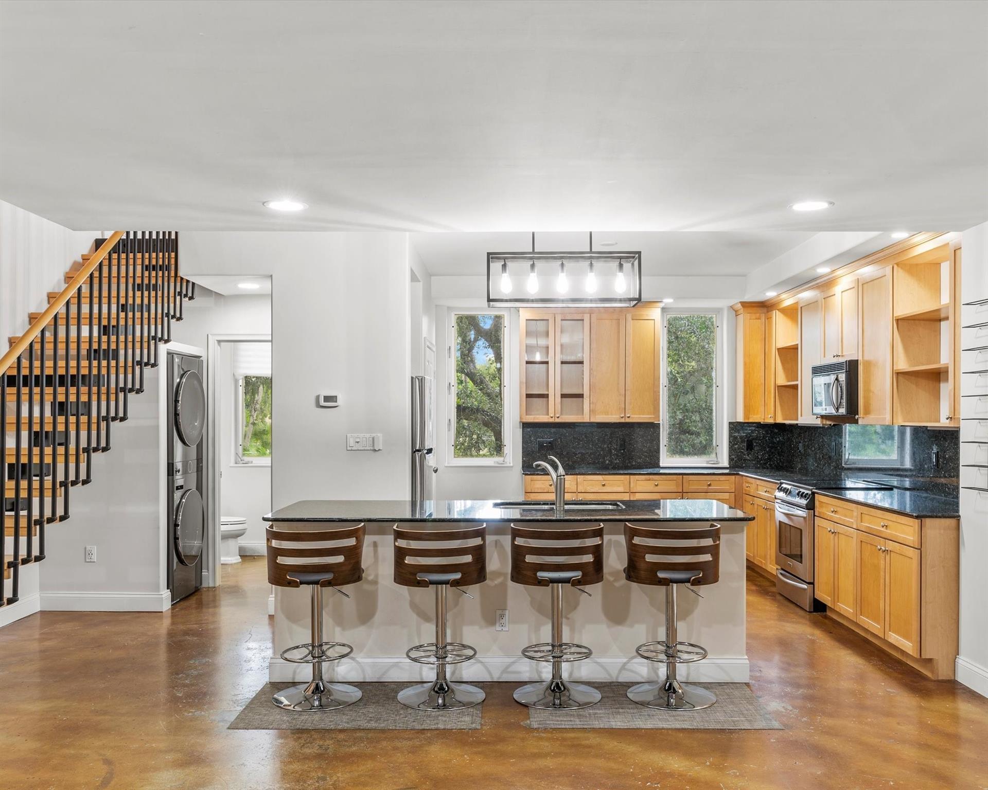 Welcome to SoNew Lofts, located in the vibrant heart of Fort Lauderdale. Just minutes from Las Olas Blvd, Fort Lauderdale Beach, and all the shops and restaurants downtown. This loft-style townhome features an open-concept design filled with abundant natural light, highlighted by impressive 17-foot ceilings and industrial-stained concrete floors that exude a sleek, modern vibe. Key features include hurricane-impact windows, stunning beamed ceilings, granite countertops, a private balcony, a spacious two-car garage, and much more. Welcome to SoNew Lofts, located in the vibrant heart of Fort Lauderdale. Just minutes from Las Olas Blvd, Fort Lauderdale Beach, and all the shops and restaurants downtown. This loft-style townhome features an open-concept design filled with abundant natural light, highlighted by impressive 17-foot ceilings and industrial-stained concrete floors that exude a sleek, modern vibe. Key features include hurricane-impact windows, stunning beamed ceilings, granite countertops, a private balcony, a spacious two-car garage, and much more.