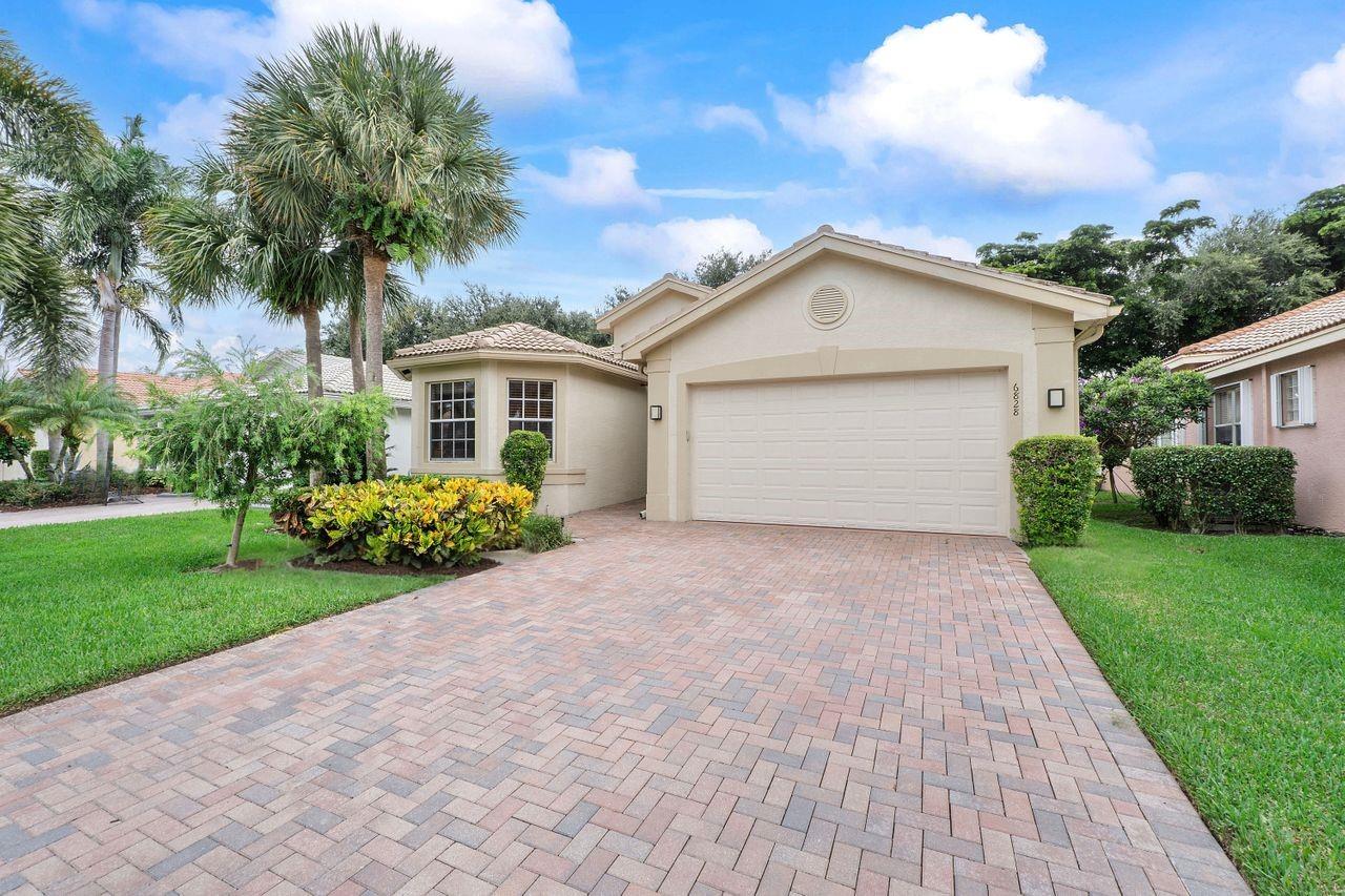 Valencia Palms - Indian Model with open floor plan, 2353 sq. ft. under AC, warm neutral tones throughout, volume ceilings, crown molding, french doors, screened patio & private yard. Gourmet kitchen w/ wood cabinets, stainless steel appliances, double ovens & snack bar open to the family rm for entertaining. Primary suite features tray ceilings, dual custom walk-in closets, dual vanities, soaking tub & seamless glass shower. Third bedroom w/ built in office, H/W heater (2020), newer washer/dryer & A/C (2021). Spectacular renovated multi-million $$ clubhouse offering tennis, pickleball, basketball, pool, spa, fitness ctr w/classes, ballroom dancing, crafts, social clubs, shows & cafe for breakfast & lunch. Pet friendly. Enjoy the country club atmosphere of Valencia Palms without club fees.