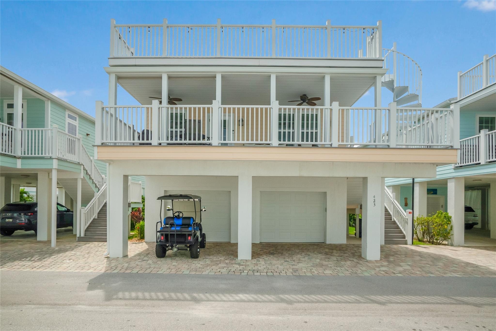 Experience coastal living in this beautiful 2018-built home with 1,202 sq. ft. under air, a 300 sq. ft. front porch, and a 250 sq. ft. sun deck offering stunning views of the St. Lucie River. The 1,000 sq. ft. air-conditioned 4-car garage, with front and rear doors, provides convenience and includes a game room. The interior features granite countertops in the kitchen and baths, a laundry room with added cabinets, and a master walk-in closet with custom organizers. Located in the gated Ocean Breeze Resort, enjoy waterfront access, a heated pool, fitness center, pickleball, steam room, and more. Walk to nearby restaurants, shops, and beaches. Monthly dues of $1,675 include property taxes. 5 minutes drive to all beaches and 15 minute drive to downtown Stuart. Sold fully furnished!