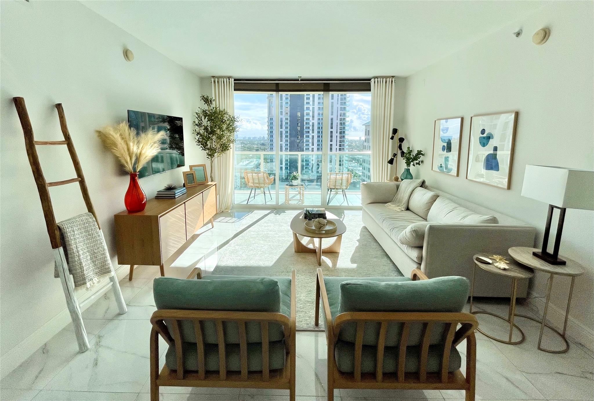 Experience this luxury residence at 350 Las Olas Place, a boutique condominium with only 163 exclusive residences. This fully furnished 2-bedroom, 2-bath unit on a higher floor showcases a Mid-Century modern décor, with a primary bedroom featuring a king sized bed and a second bedroom with a convertible sofa bed. Both spa-like bathrooms are beautifully renovated, and there’s a separate laundry room with a washer/dryer for added convenience. Available right away upon approval, this residence is located right off Las Olas Boulevard's shops, dining, Publix grocery store and nightlife, and close to the beaches & airport. Amenities include a rooftop pool, spa, gym, and social room. Rent includes water, internet, and TV. Your perfect Fort Lauderdale getaway!