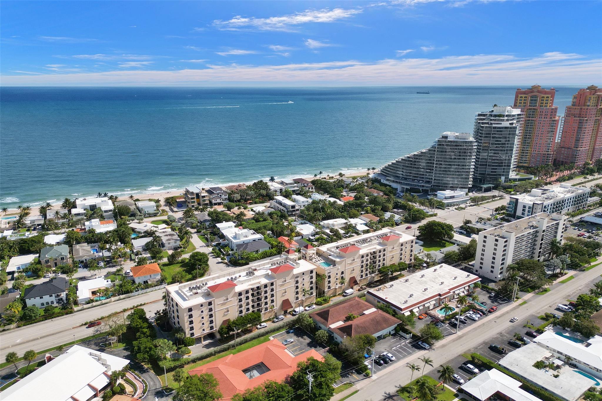 Experience sophisticated modern living at  the Fountains on Ocean Boulevard condo, where luxury meets impeccable style. This one-bedroom + office/den residence comes with exquisite updates, ensuring a seamless move-in. The custom kitchen impresses with sleek two-tone cabinetry, quartz countertops, a built-in double oven, & wine storage. The spacious primary suite offers a custom walk-in closet & a stunning bath retreat featuring a double vanity, backlit mirror, and a walk-in shower. Throughout, you'll find custom doors, millwork, & striking fixtures. Enjoy ocean views from the rooftop pool, along with the convenience of in-unit laundry, secure garage parking, & pet-friendly amenities. Perfectly situated just a stroll from Fort Lauderdale Beach and an array of fantastic dining options.