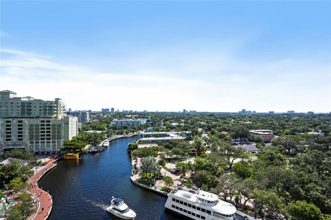 ANNUAL LEASE Turn-key fully furnished with spectacular views in the heart of downtown Fort Lauderdale. South facing sunny unit with views over the downtown skyline, New River, intracoastal and the ocean. Split spacious floor plan with open living spaces, and access from every room to the extra large 34' balcony. Spa like master suite with double vanities, jacuzzi tub, stand-up shower and walk-in closet. Guest suite features private hallway and walk-in closet. Resort-style amenities 24-hour guest valet, security, clubroom, billiard room, fitness center, heated/saltwater pool, cabanas and hot tub. Just steps to the water taxi, top restaurants, shops and entertainment, quick bike ride to the beach, Brightline, and more. Includes 1 gated garage space.