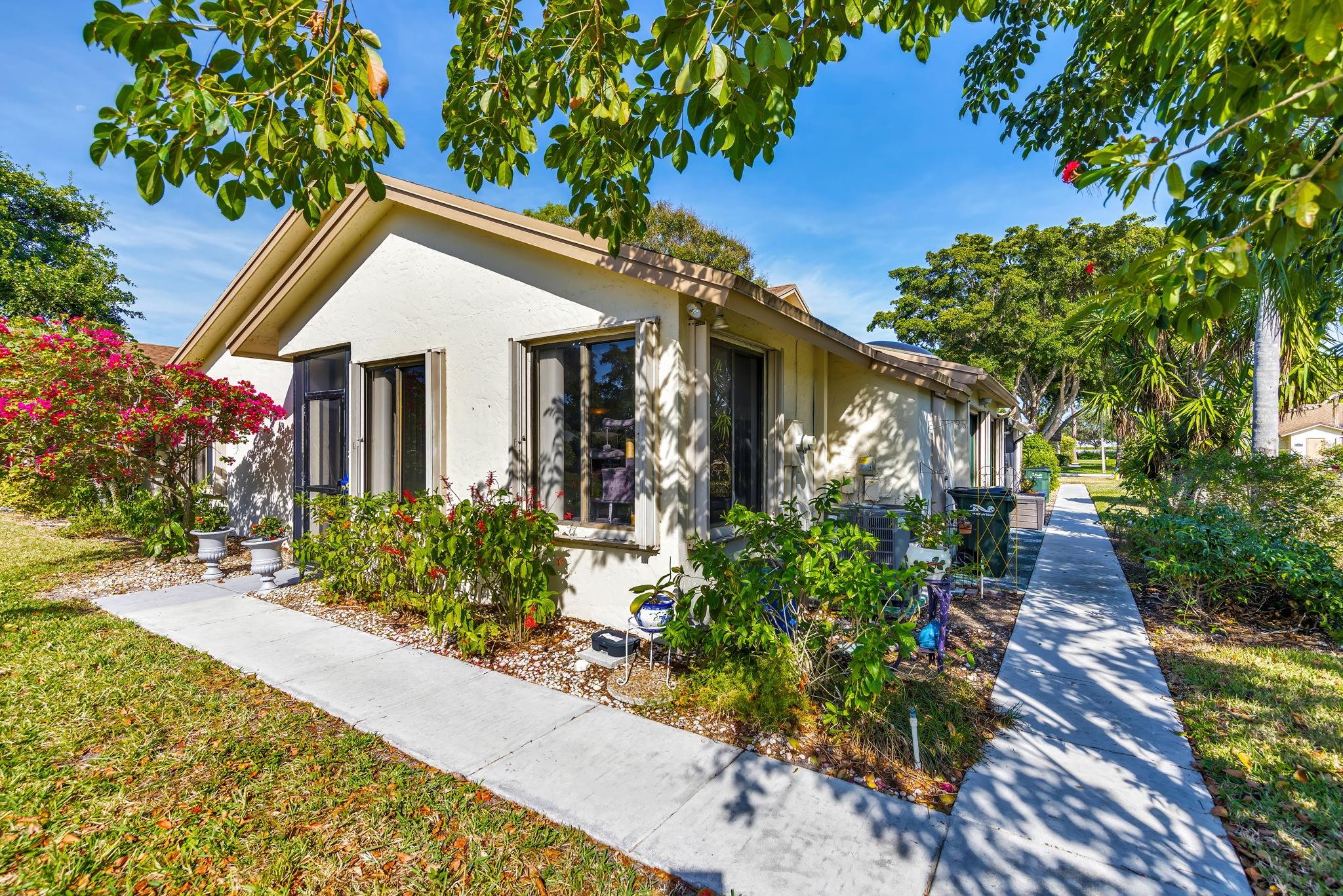 This serene lake view home is in the very active 55+ community of Rainberry Bay. With plenty of windows, it's very bright, and the large open concept living/dining area allows for comfortable entertaining. And it features an additional Florida room that can be used as an office or as a den. Add to that the beautiful lake view and walking path, and you have a wonderful, relaxing retreat. The community is gated entry, and has 5 heated pools, a spa, tennis, pickleball and bocce courts, and a gym/fitness room. It’s close to the beaches and everything else Delray has to offer.