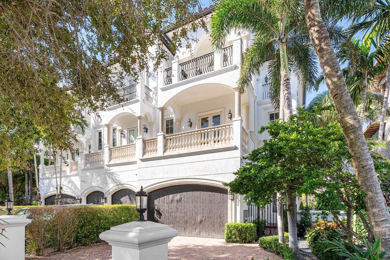 Experience luxury coastal living in this elegant 3-story townhouse on “The Island,” positioned along the Intracoastal Waterway and mere steps from iconic Deerfield Beach. This end-unit offers 3 ensuite bedrooms with private balconies, a personal study off the primary suite, and a great room that showcases sweeping views of the Deerfield Island Preserve. Features include soaring custom ceilings, stunning gourmet kitchen, Lutron LED lighting system, and a 3-stop elevator. Outside, enjoy a spacious lanai, private heated pool, dock w/boat lift, standby generator, and a 2-bay garage with a lift for a 3rd vehicle. Enjoy the charm of nearby beachfront eateries on this scenic barrier island, with the added convenience of being just minutes from vibrant downtown Boca Raton and the executive airport