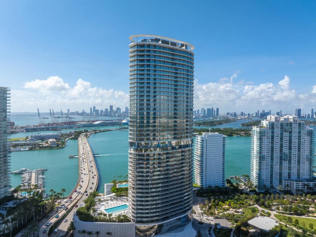 Welcome to the prestigious Canope level at Five Park Miami Beach, where luxury meets breathtaking vistas. This exquisite four-bedroom, four-bath residence features an exceptional floor plan that maximizes stunning ocean and bay views. Expansive windows and soaring 10-foot ceilings create an airy atmosphere with oversized balconies. The Gabellini Sheppard-designed kitchen is a culinary masterpiece, showcasing Italian oak cabinetry, top-of-the-line Gaggenau appliances, and elegant marble finishes. Enjoy exclusive access to the Canopy Club, offering private dining, wellness lounges, and curated services tailored to your lifestyle. Experience resort-style amenities, including two pools, a spa, and a private beach club, all designed to elevate your living experience to unparalleled elegance.