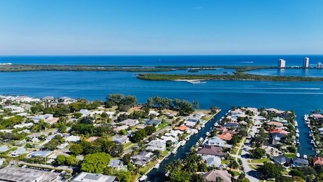 Discover luxury waterfront home in one of the best locations in North Palm Beach! Only a few  remaining properties  are limited and selected to  offer deep water ocean access with no fix bridges, minutes to the ocean, the inlet and Peanut Island,15 minutes away from Palm Beach International airport ,10 minutes away from high speed brightline Train station .
This stunning waterfront 5-bed/4-bath home on the Intracoastal Waterway ,full hurricane protection ,and oversized lot(0.41 acre) with 120 feet seawall with a brand-new dock with 2 boat lifts(32,000 and 6000 lbs) also a jet ski lift. Large Back Yard  just like mini resort-style tropical jungle garden forest ,everything you need just bring your drink to the pool side and enjoy large covered patio, summer kitchen, North Palm Beach is designated as a golf cart friendly community, famous with such assets as warm weather, sunshine, golf, ocean fishing, boating, sandy beaches, and balmy breezes, the Village has much to offer enthusiastic people who are raising families or are looking to retire.  Features several beautiful parks, such as Anchorage Park, with playgrounds, docks, volleyball courts, tennis courts, and even a dog park. The Village is also home for the North Palm Beach Country Club, featuring an Olympic swimming pool, A Jack Nicklaus Signature Golf Course, and a full featured Tennis Facility with Har-Tru courts. North Palm Beach is a coastal community with easy access to both the Palm Beach and the Jupiter inlets , the best fishing in the world. Close to great shopping, fabulous restaurants, parks, beaches, and golf. Minutes to I-95 high way . fire-pit and a custom heated salted water pool with water slide and Jacuzzi,  tropical landscape and jungle garden easily involved in complete privacy, this is  your own Florida life style private oasis in one of the most desirable locations in North Palm Beach .