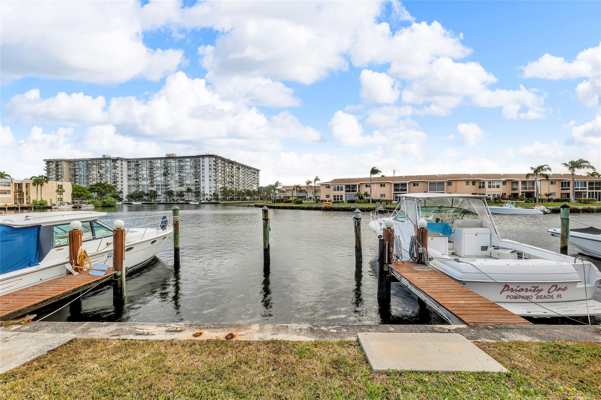 Happiness awaits you in this boaters paradise where every owner has an assigned, private dock at no cost as the  Association owns & maintains while furnishing water, electric and lighting.  Also this lovely unit is located in the best location in the complex, that being the South Exposure, which allows for the largest boats as well as the best breeze and water views. The unit has been beautifully renovated, with recent new convection Samsung range and refrigerator. Enjoy the dinners from the screened enclosed balcony with one end open for more views and ventilation. Also included are hurricane shutters and custom designed balcony screens.  Amenities for the community include clubhouse with TV, Wi-Fi , fitness center, ice maker, 2 tennis courts, pickleball, heated pool, hot tub, & sauna.