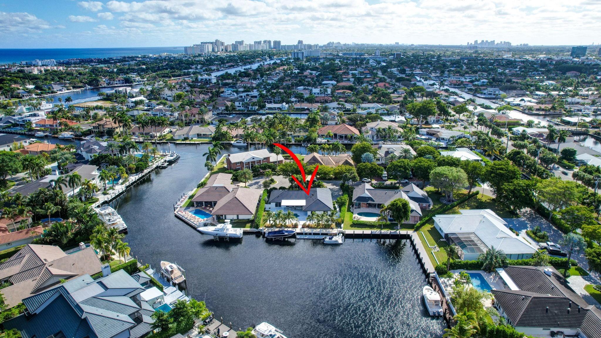 Located in Fort Lauderdale's premier 24/7 guard-gated deepwater community. Enjoy stunning simplicity & functionality. Custom sophisticated island-inspired single level residence. 2022 total renovation shows as NEW: metal roof, plumbing to street, all new electrical, air conditioners, tankless water heater & generator. Latest open concept living, great room, new Chef's kitchen, porcelain floor tiles, new impact glass & interior doors. Private Primary Suite, dual closets, new modern spa style bath, enclosed water closet, soaking tub & floating vanities. Split floorplan: 2 secondary bedroom suites, office (4th bed) + cabana bath. Most rooms access pool & wide-open turning basin views, incredible outdoor areas, 95 ft protected dockage. Perfectly located for Pine Crest & other A rated schools. Bay Colony features full time (24/7) armed security with only one guard house and access point.  There are only 108 residences in Bay Colony as of this listing.

2022 Custom Renovation (in addition to the above) includes:-

Interior:

* Large format porcelain tiles matching throughout the residence.
* Mud-room/utility room with double LG washer and dryer systems and refrigerator, plus folding area and ample storage closets, desk area.
* High-end plumbing features throughout include Porcelanosa and Toto
* New interior doors & baseboards
* Entirely new electrical service and custom lighting throughout the residence.
* All new bathrooms with floating vanities and LED Mirrors.
* Primary Suite: Separate custom closets, large spa style bathroom with enclosed water-closet, large shower and soaking tub. Window to exterior for natural light. Floating Italian style vanities with LED Mirrors & make-up area. Sliders to the pool area.
* Entirely separate wing for the two secondary suites (both with new custom bathrooms) and home office (potential 4th bedroom). New cabana bathroom with exterior door to pool area.
* Side access oversized air-conditioned garage with epoxy floors and large windows provide natural light. Currently doubles as gym.
* Water softener
* Tankless water heater

Exterior:

* Two Carrier Air Conditioners - 5 and 2 ton.
* Circular driveway includes side access garage with parking for at least 6 cars on the side plus the circular driveway.  All new pavers in the front and side pathways. New double entry front doors.
* Fenced and gated rear backyard.
* Fully renovated pool with marble pool decking and large covered terrace provides for outside dining and lounging.
* Marble decking surrounds the entire pool area with large sunning area and separate area for firepit and grilling.
* New docking with lighting and electrical service (boat lift excluded)
* Professional landscaping throughout the entire property.
24 KW Generator
* New sea wall cap and dock