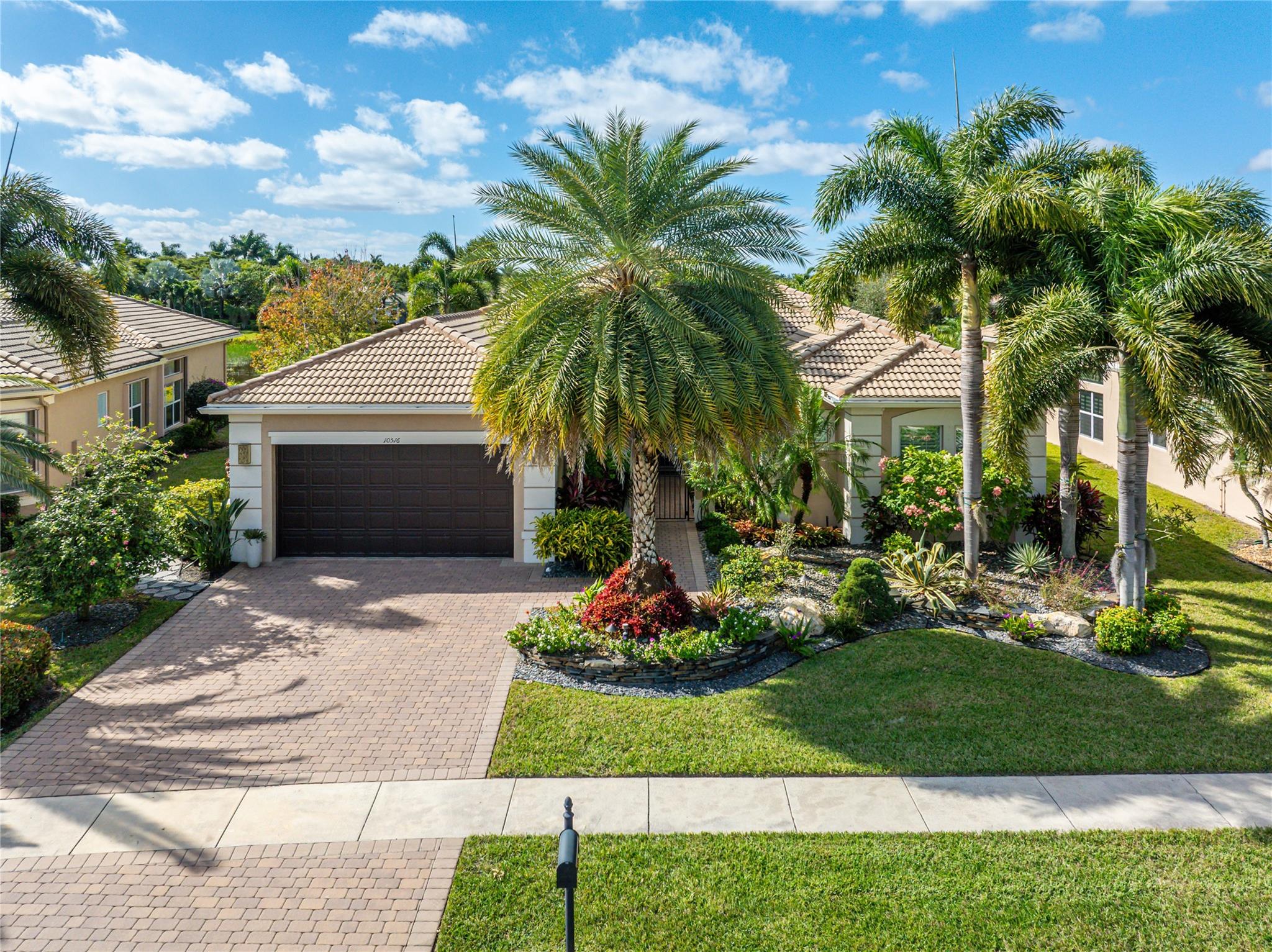 Look no further and welcome to paradise at Valencia Reserve in Boynton Beach. This showstopper has it all! The custom "Pamplona Grand" model is a lakefront estate boasting 4BR, 3BA, 3540sf and private heated (and salt chlorinated) pool & spa. A masterful floor plan includes designer finishes, decorator touches, marble and wood flooring, spacious gourmet chef's kitchen w/ gas range, double-oven, pull-outs, and ample storage. Meticulously maintained to perfection, showcasing light & bright spaces, expansive Owner's Suite, summer kitchen, extended covered patio. Impact windows, whole-home generator and 2-car garage compete this turnkey existence. Experience refined living in the exclusive, gated, active-adult community with clubhouse, cafe, tennis, pickleball, bocce, pools and fitness center.