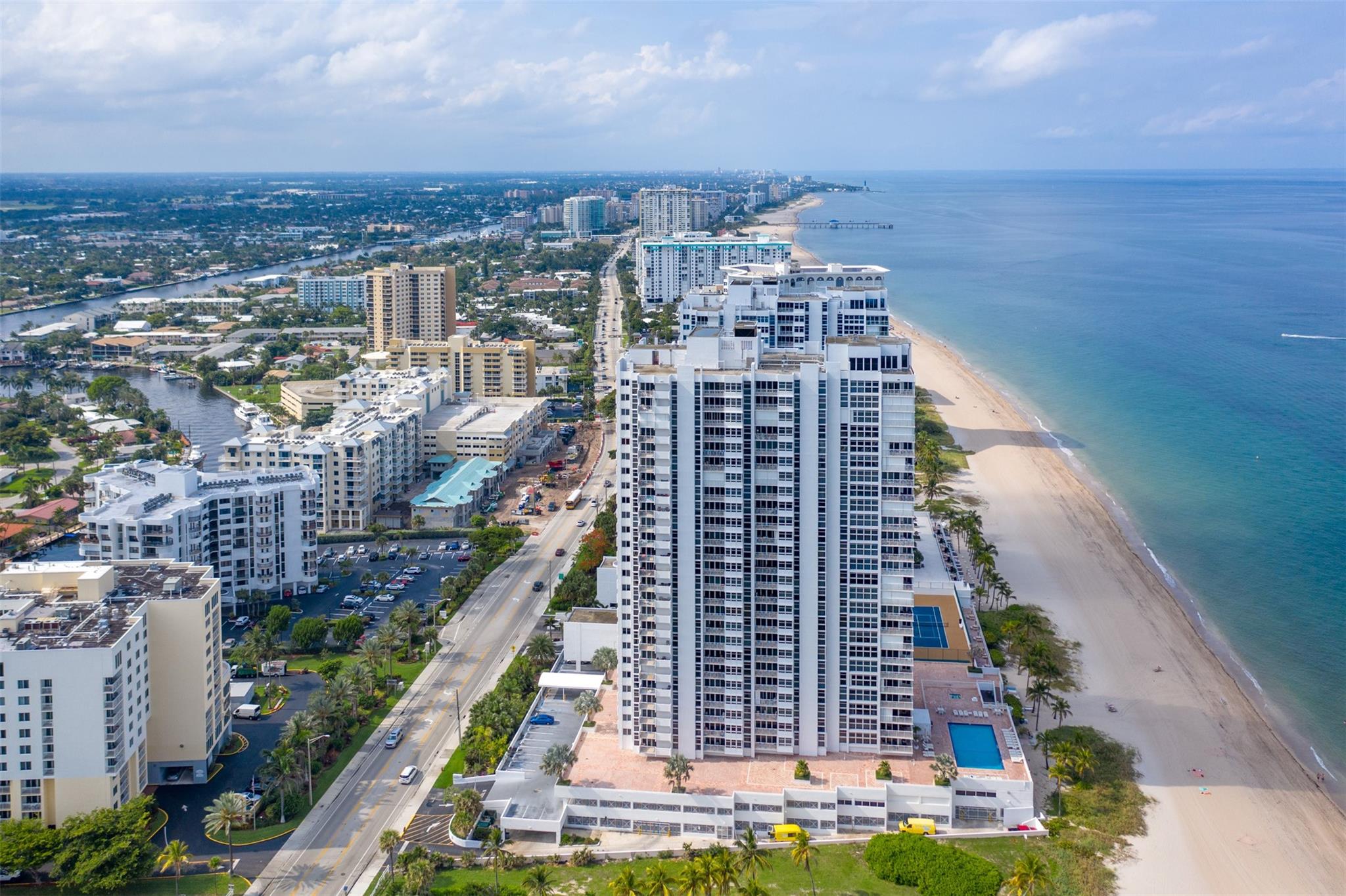 Nestled between Ritz-Carlton & Waldorf Astoria residences, this beachfront condo epitomizes luxury living. Floor-to-ceiling impact glass windows and doors frame breathtaking Ocean & Intracoastal views, creating a serene atmosphere throughout. Recent upgrades include newer refrigerator, in-unit washer/dryer, updated kitchen appliances, water heater & AC. Security is paramount w/ 24-hour guards & gated access, providing residents peace of mind. Enjoy unparalleled amenities such as a heated pool, spa, sauna & tennis/pickleball court for recreation. Beachfront BBQ deck is perfect for outdoor gatherings, while garage parking for 2 cars, including 1 assigned spot, adds convenience. Sky lounge offers panoramic views of the coastline & city skyline, making it ideal for relaxation or entertainment.