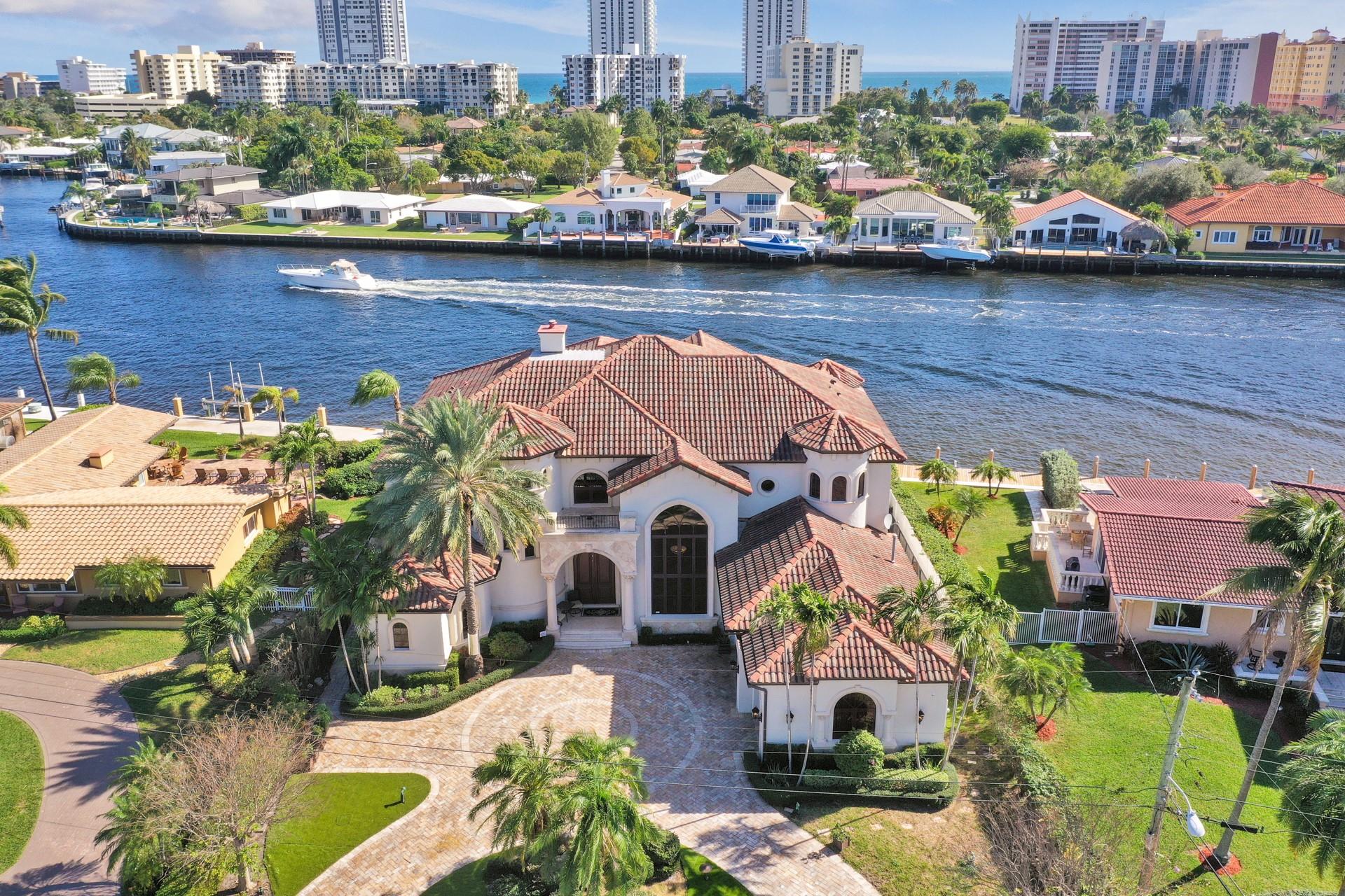 Experience luxury living at its finest with this exceptional property located directly on the Intracoastal in beautiful Pompano Beach. This fully furnished 4-bed, 5.5-bath home boasts over-the-top amenities and breathtaking water views, setting the stage for the ultimate South Florida lifestyle. With 90 feet of prime waterfront, the property is a boater's dream, featuring a private dock and a boat lift for easy water access. Step outside to your private oasis, complete with a sparkling pool, spa, and lush tropical landscaping. Inside, every detail has been thoughtfully curated to provide comfort and style, ready for you to move in and enjoy. Don't miss this rare opportunity to rent a true waterfront gem! Call us now for a showing!