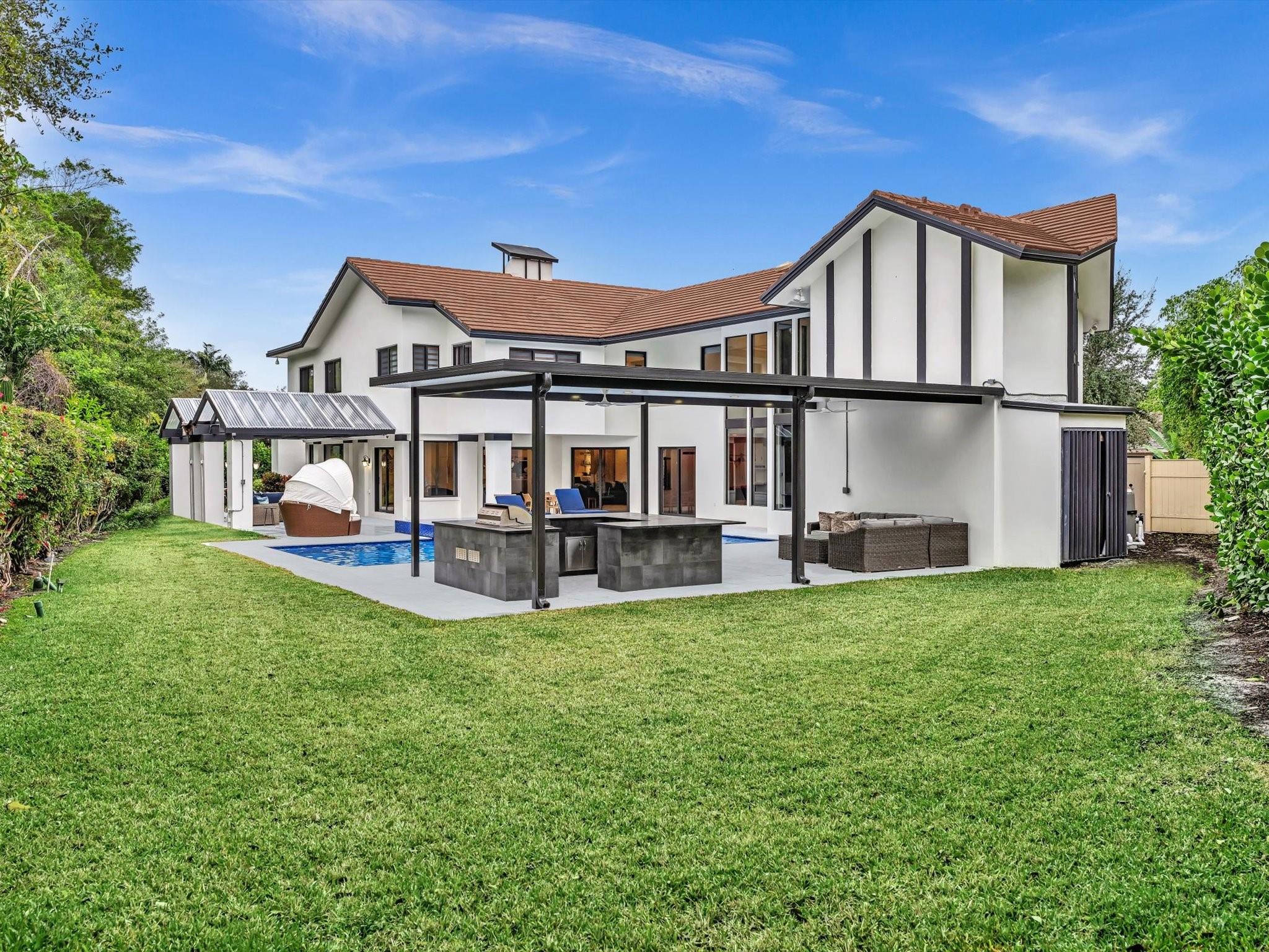 Unbeatable combination of LUXURY & VALUE in the prestigious gated community of The Sanctuary. This newly renovated 7-bedroom estate located in a cul-de-sac offers over 8,000 sq ft of luxurious living space & exceptional value per square foot. This rare opportunity places you in one of Boca Raton’s most sought-after neighborhoods, known for its privacy, security, and exclusivity. Highlights include a lavish primary suite with a spa-style bathroom, expansive walk-in closets, a chef’s kitchen w/premium appliances, home theater, gym, wine cellar, wet bar, brand-new resort-style heated pool & spa, plus an outdoor kitchen. Set on a corner lot with no rear neighbors, it offers unmatched privacy. Community amenities include a private marina, tennis & pickleball courts, dog park, and a playground.