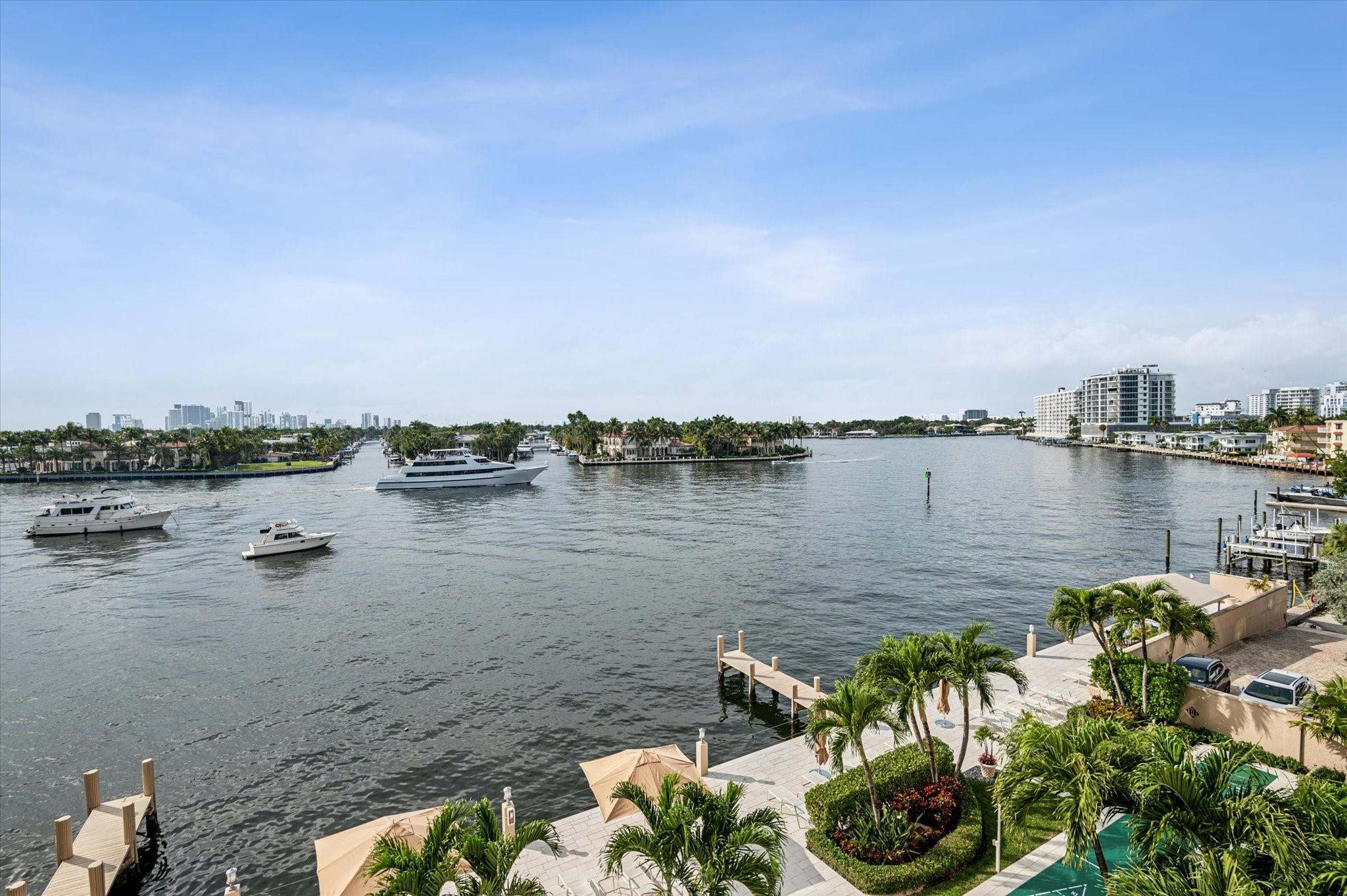 50-year Recertification complete and financially strong with a new roof coming soon. Stunning direct Intracoastal views with a boat parade every day. The wall-to-wall stacking windows in the living room open to elevate the sensation of being by the water. Tastefully remodeled throughout, crown molding, impact windows & plantation shutters. The kitchen has granite counters with custom wood cabinets & backsplash. Both bathrooms are equally well done with beautiful tile, custom made cabinets and closets. The pool & expansive deck area has undergone a total beautification transformation and looks fabulous. On the Intracoastal at the widest Point, The Versailles is a Boutique-sized Mid-Century Modern jewel 1 block to the Beach. Close to many fine eateries on the Beach, Las Olas, & Breakers Ave