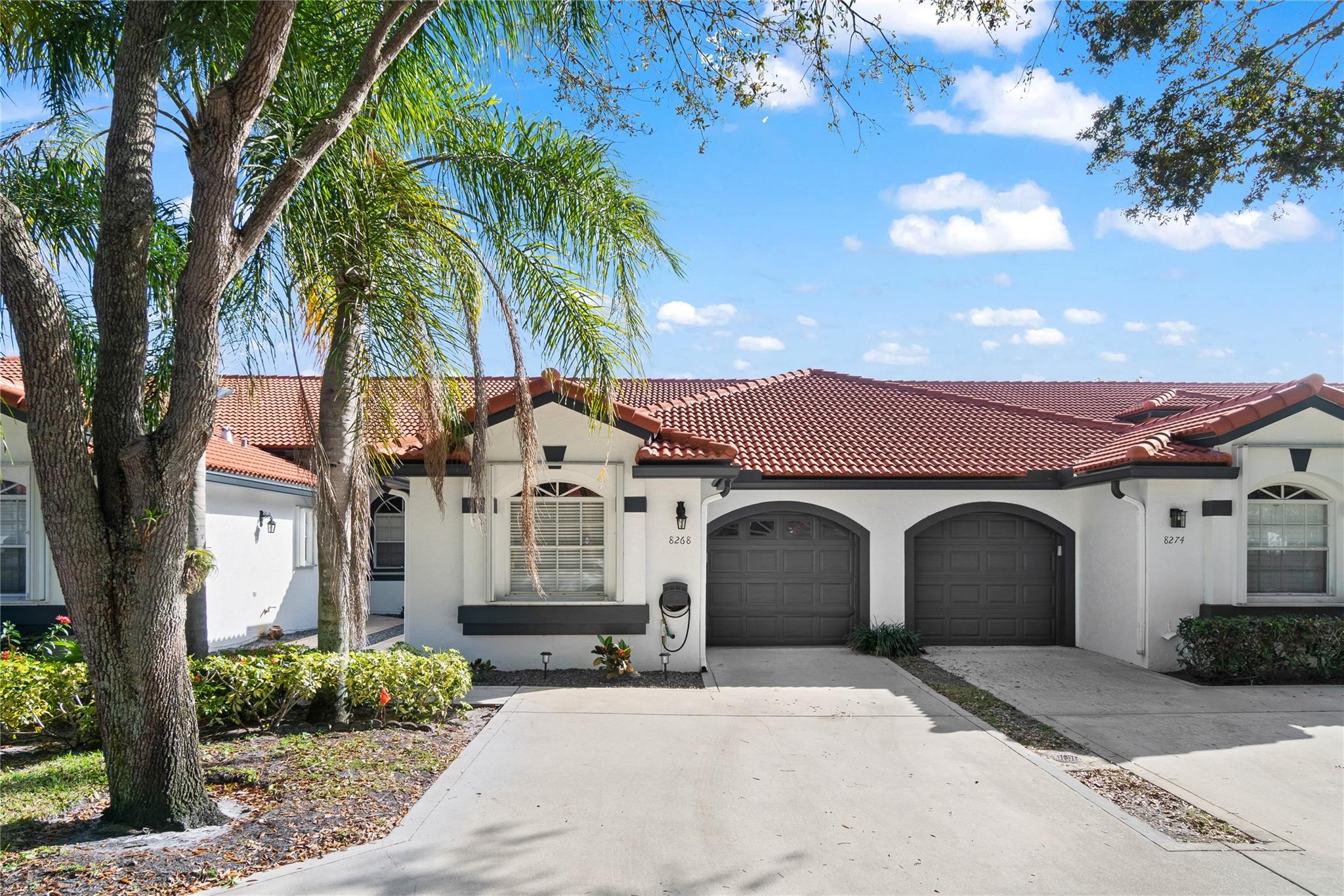 This updated single-story villa offers a perfect blend of comfort & tranquility. Step into a light and bright interior featuring vaulted ceilings, porcelain tile flooring (2020), & a modern updated kitchen with stainless steel appliances. New roof! (2020). The peaceful backyard is perfect for relaxing or entertaining. Upgrades to this home also include a new AC (2025), new washer/dryer (2024), & fresh exterior paint (2024). Accordion shutters for hurricane protection. Located in a gated, pet-friendly community w. 24-hour manned security, this home offers amenities including a large pool w/ hot tub, tennis & pickleball courts, a playground, fitness center, and a clubhouse. Plus, it is zoned for all A-rated schools. Don’t miss your chance to live in this resort-style community in Boca Raton