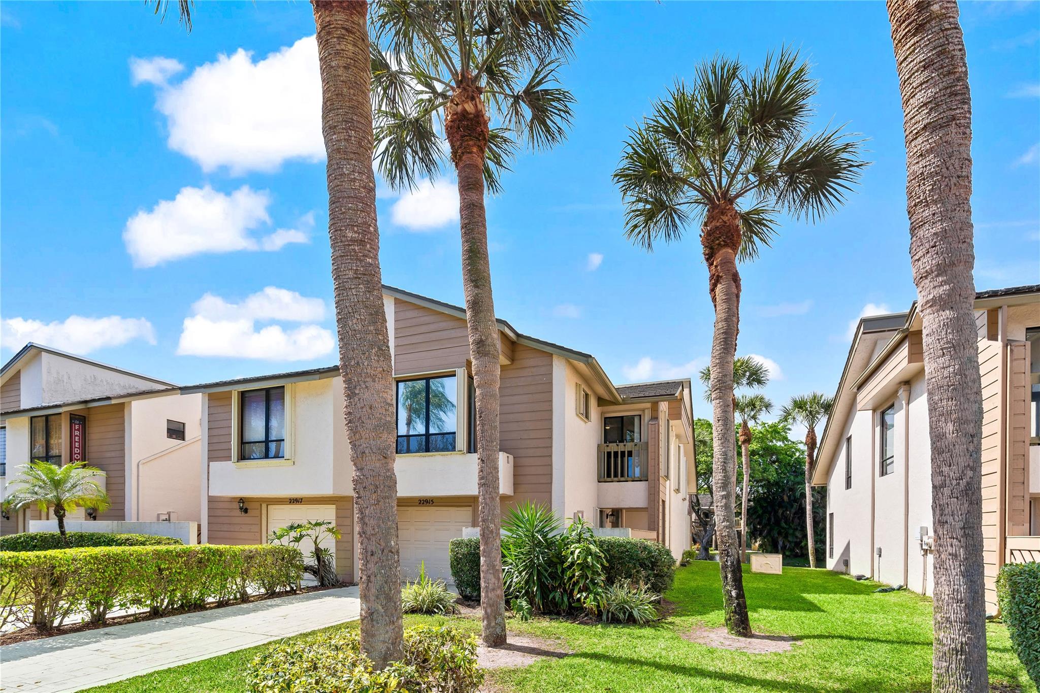 Beautiful & rarely available corner unit in Ironwedge, overlooking the lake and close to the pool! 3/2 with 1CG updated & filled with light. Open concept design with 19ft ceilings in living room & a wood burning fireplace. The unit has been well maintained & upgraded throughout the years w/ new top of the line synthetic roof with 20yrs warranty in 2018, new A/C in 2025, new floors in 2025, updated baths & kitchen w/ granite counter tops & Whirlpool appliances, central vacuum. Its corner situation offers an extra large tiled open patio along the lake. Accordéon shutters & clear panels. Nested in Boca Del Mar, in the heart of Boca Raton, Ironwedge is in a A+ school district. 2 pets permitted w/ bread restrictions. Termite contract & quarterly pest control. Leasing after 2 yrs of ownership.