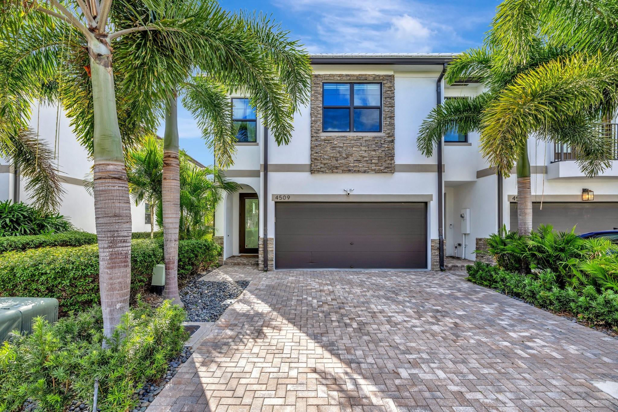 Price Improvement so don't miss out!! Luxury living made easy with this newer build, fee simple townhome rarely available in beautiful Dania Beach. Built in 2020, and the only corner "Sampson" Floor plan, model like, and modern 3/2.5 bath home with a 2- car garage. The master bedroom is expansive with plenty of room for a siting area. It also has a luxurious, large walk-in closet with built- in container store closet systems in the master and second bedroom. There is also a porch off the master overlooking the preserve offering peace and tranquility.  It is 2 miles from the new Dania Pointe shops/restaurants and 4.5 miles to Hollywood beach. Please contact the agent, Brandi or request through showing time for a private showing. 24-hr notice