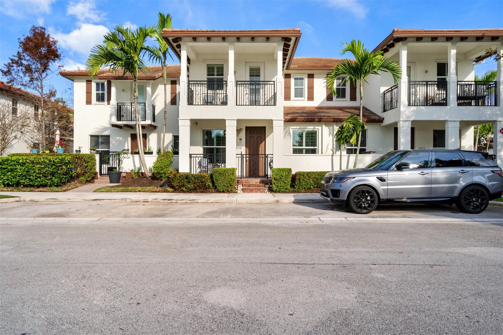 This beautiful townhouse is nestled within the gated community of Paloma Lakes, conveniently located right across the street from The Promenade. It boasts a picturesque view of the lake, visible from both the downstairs open porch and the upstairs open balcony in the main bedroom. The home offers 3 bedrooms and 2.5 full bathrooms, along with a 2-car garage, and plantation shutters throughout. You'll find porcelain flooring, a fire sprinkler system, and full hurricane protection for peace of mind. For added convenience, the laundry room featuring a full-size washer and dryer is situated on the second floor. The main bedroom includes his and hers walk-in closets, and one of the additional rooms comes equipped with a built-in office. This property is ideal for both end users and investors.