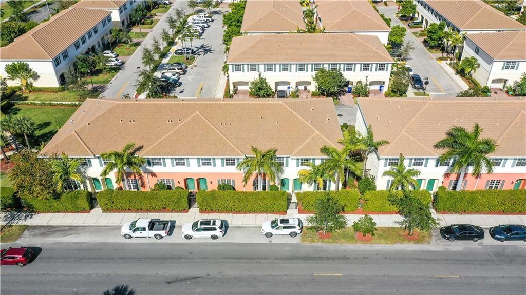 RARE Meticulously Maintained CORNER UNIT 3Bd 2.5 Bath, PERFECTLY Located Near (Beaches, Shopping, Restaurants, Tennis Centers & Airport) This Beautiful Home features High Ceilings, Complete Hurricane Protection (Impact Windows & Doors), 18" Neutral Ceramic Tile Throughout Living Areas, Open Floor Plan - Chef's Dream Kitchen (Dark Wood Cabinetry, Granite Countertops, and Glass Tile Backsplash, SS Appliances) Opening to Family and Dining Areas. Large Master (HUGE Walk-In Closet, Dual Sinks and Separate Shower in the Master Bath), Attached Private Garage, Keyed Entry Lockset, Fire Sprinkler Suppression System, Pavered Drive. Lots of Parking available for this unit as it is on the perimeter of the property.