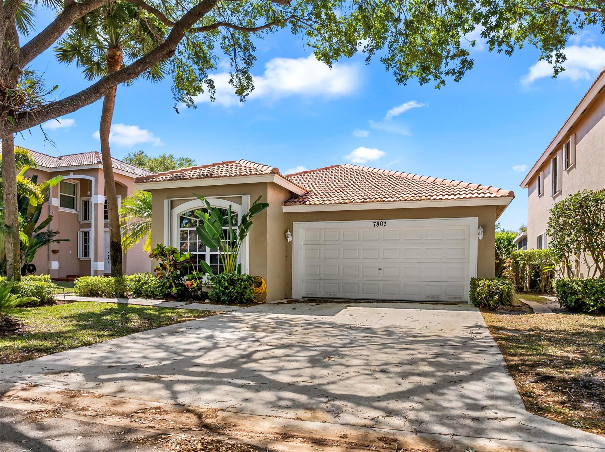 Welcome to this beautiful 4-bed/2-bath home, located in a desirable gated community in The Lakes of Parkland. Step outside to the screened patio, where you can relax and enjoy views of your private, fenced garden An ideal space for outdoor living. Inside, the updated kitchen features granite countertops, real wood cabinetry, and stainless steel appliances, and a wine fridge perfect for the home chef. Each bedroom boasts high-end laminate flooring.  Feel secure with complete full hurricane shutters. The HOA covers all landscaping, providing a worry-free lifestyle. Enjoy the community pool and take comfort in knowing this home is zoned for Parkland's A-rated schools, making it a perfect choice for families. Don’t miss the opportunity to make this your dream home!