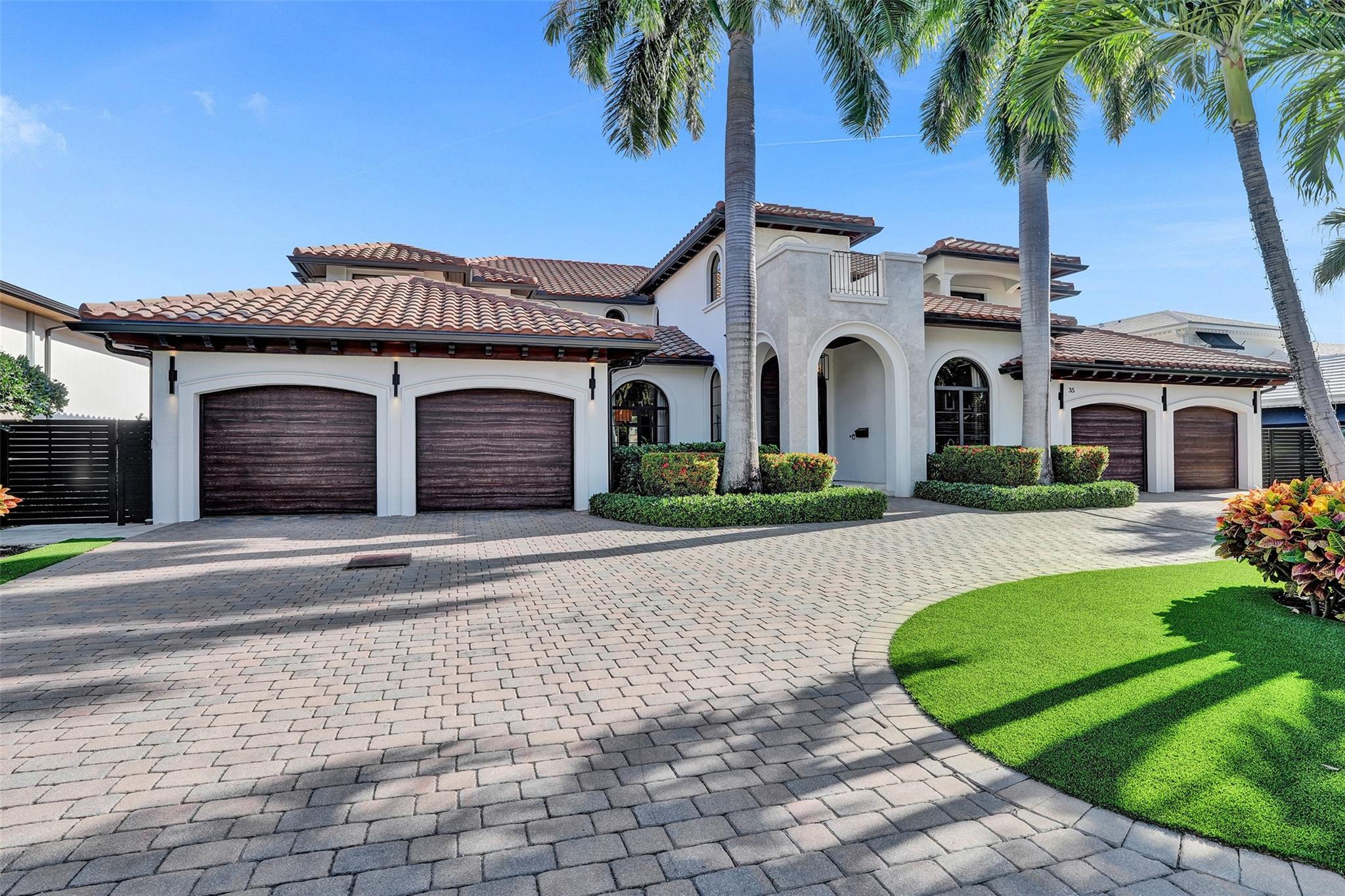 Welcome to Ft. Lauderdale's premier neighborhood of Bay Colony. Small enclave of less than 125 waterfront homes. True 24/7 security with armed guards and patrols. This custom home was built in 2009 by high end builder. Almost 7,000 sq feet of living space + 4 car garage + large balconies. Timeless design with no expense spared. Incredible living spaces- both formal DR and large eat in kitchen. Formal living overlooking the water, large family room off the kitchen and dynamic "Club Room" with large bar and incredible detailing. Volume ceilings thruout. Incredible Master suite w/ sitting room, 2 closets and his/her baths. 1st floor has "Jr Master" and office. Elevator, whole house generator, 42k LB boat lift, huge covered porch w/ summer kitchen. Great water views. All bedrooms ensuite.