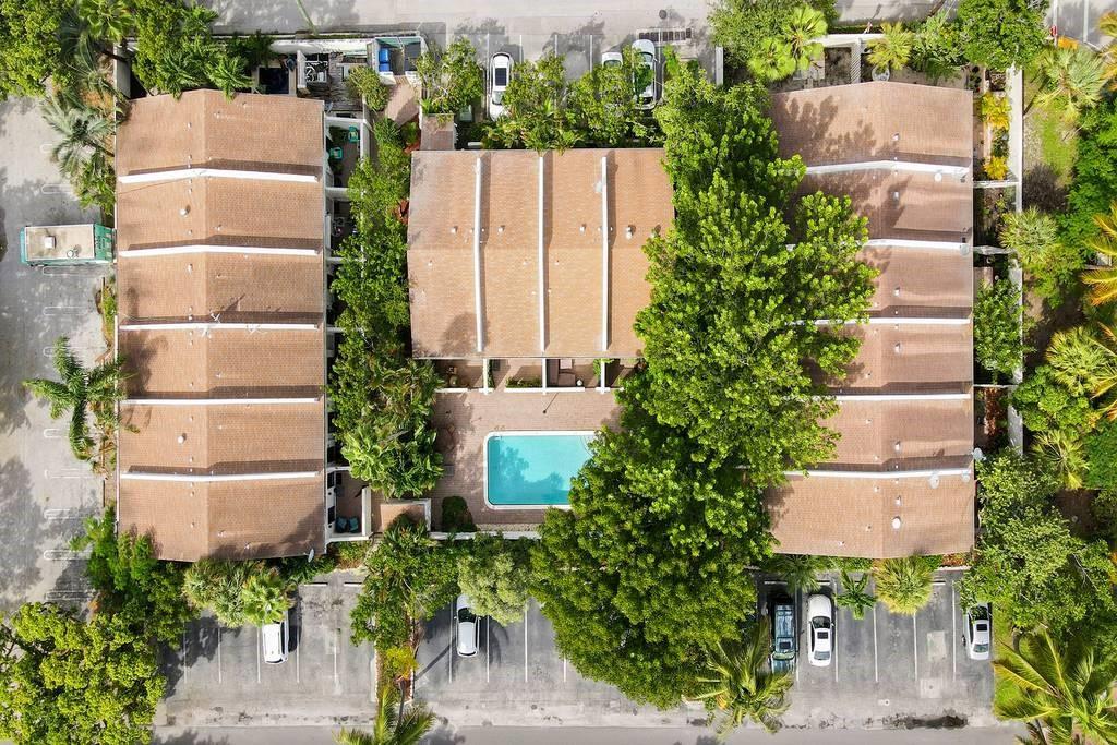PRIME LOCATION stylish 2-bed, 2.5 bath townhome is a true hidden gem in the highly desirable Victoria Park neighborhood. Brand new HVAC system (2025), Impact windows and doors (2023) & new roof (2023). Tucked within a lush, gated, and walled 16-unit community, the property offers a tranquil atmosphere complete with a large pool and sundeck. Inside, the move-in ready home features a bright, open-concept main floor with a private front courtyard and rear patio. Upstairs, a spacious split-bedroom layout, ideal for privacy. Assigned tandem parking. Pull-down attic access. Located just minutes from Las Olas blvd, shops, markets, restaurants, parks, performing arts venues, sports facilities, and Flagler Village, this home delivers a peaceful lifestyle in the heart of downtown Fort Lauderdale.