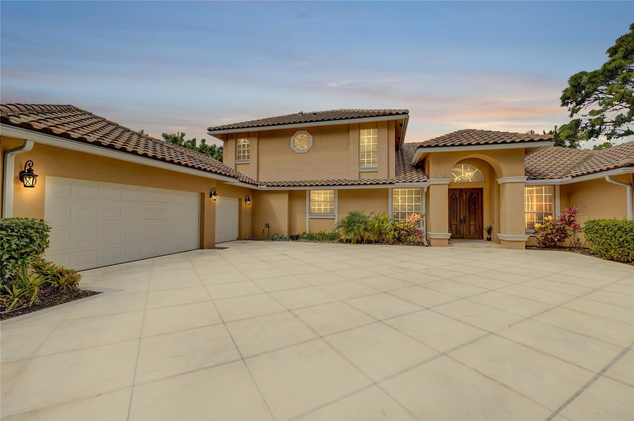 Discover comfort and luxury in this stunning 2-story home, tucked inside a private gated community at the end of a quiet cul-de-sac. Set on over 16,000 sq ft, this 3,600+ sq ft home offers high ceilings, tons of natural light, and peaceful lake views. Enjoy a cozy living room with fireplace and built-in bar, plus a chef’s kitchen with custom wood cabinets, granite counters, and a walk-in pantry. The first-floor primary suite features tray ceilings, dual closets, a spa-like bath, soaking tub, and walk-in shower. Entertain outdoors with a screened kitchen, saltwater pool, and spa. Includes 3-car garage, 2023 AC, and 2015 barrel tile roof. Stay friendly.