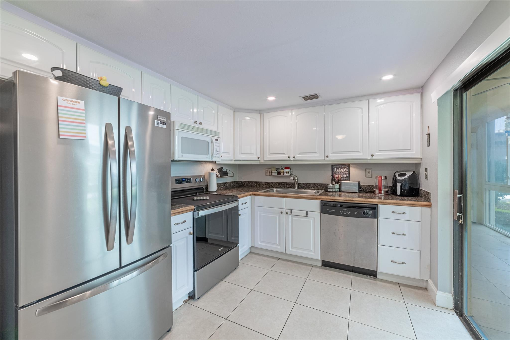 Florida lifestyle in the sought-after Isle of Capri at Kings Point (55+). This ground-floor, condo dazzles with abundant natural light, upgraded kitchen and baths, newer appliances and full-size washer/dryer, a 2019 AC, and a glass-enclosed patio. Flexibility to purchase furnished or unfurnished. CBS construction, covered walkways, and a prime location near golf courses add to the appeal. In this gated community, you’ll discover everything from pools and tennis to a theater, café, and courtesy buses. Easy to show—come experience it today!