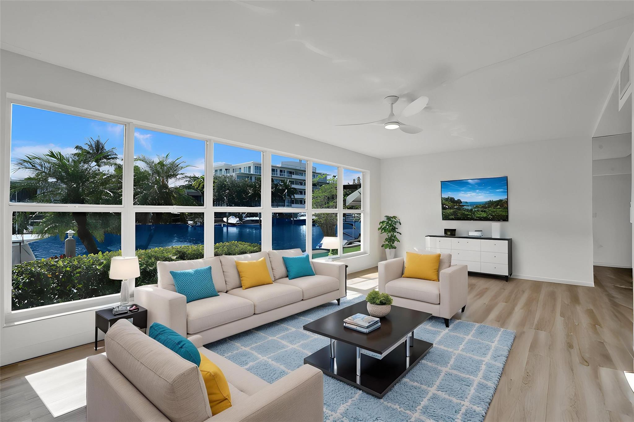 Finally! A rarely available 1st Floor Corner 2 BR/2 BA Residence walkable to both Las Olas and the Beach for under $500,000!  Gorgeous west-facing panoramic waterfront Views! BOAT DOCKING  privileges at no charge! Updated baths both with walk in showers.   Entertain/ BBQ at your doorstep  patio; Now it's possible to own in Fort Lauderdale's hotly appreciating Nurmi Isles at one of the OASIS villas in a lush tropical setting close to both downtown AND the Beach; Concrete structure/high impact windows. Unique house-like living all designed by   renowned mid century modern architect Charles McKirahan.  This tranquil OASIS with extra large heated swimming pool is south Florida's hidden gem! (Virtual furniture added to some photos). Well managed with strong reserves. LAND SHARE AVAILABLE. Photos include exterior shots of various buildings and common areas  in the OASIS complex.  Interior Photos coming soon!