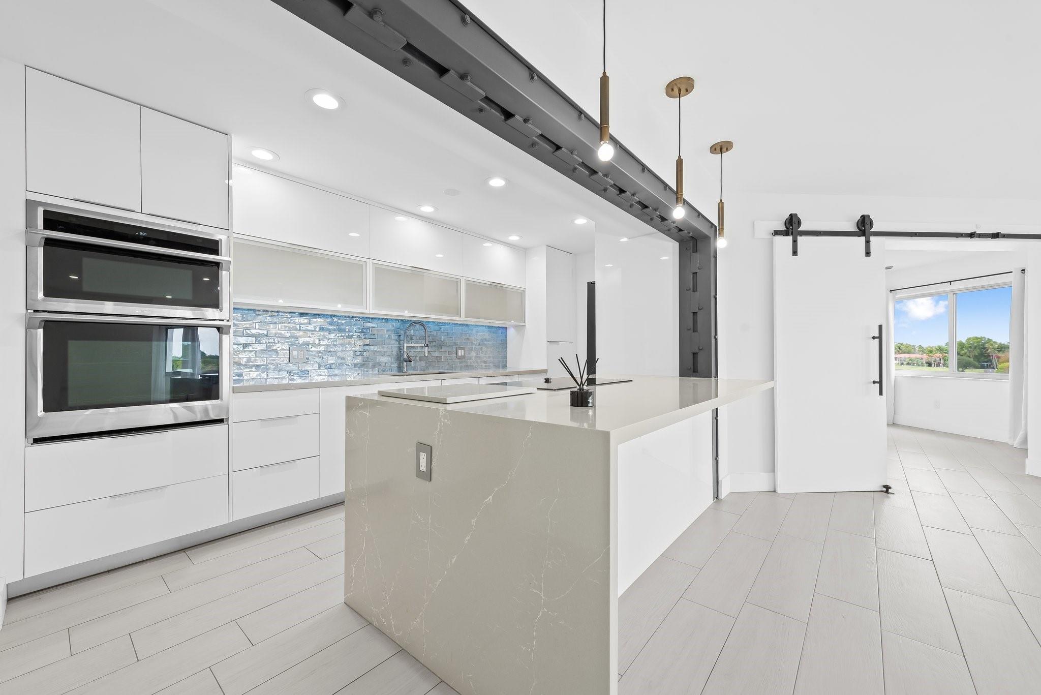 Welcome to your dream condo at Lake Azure! This fully renovated 1,954 sq ft residence offers luxury living with 3 bedrooms plus large den, 2 bathrooms, and a bright, open living space featuring northern exposure and modern charm. The state-of-the-art kitchen includes stainless steel appliances and an island design perfect for entertaining. The primary bathroom is a spa-like retreat with a soaking tub, steam shower, and marble finishes.
Enjoy resort-style amenities: pool, sauna, gym, clubhouse, and more. Outdoor features include a common courtyard and barbecue area. With central AC, in-unit washer/dryer, guest parking, video security, and an elevator, this condo ensures comfort and convenience. Experience the best of Miami living!