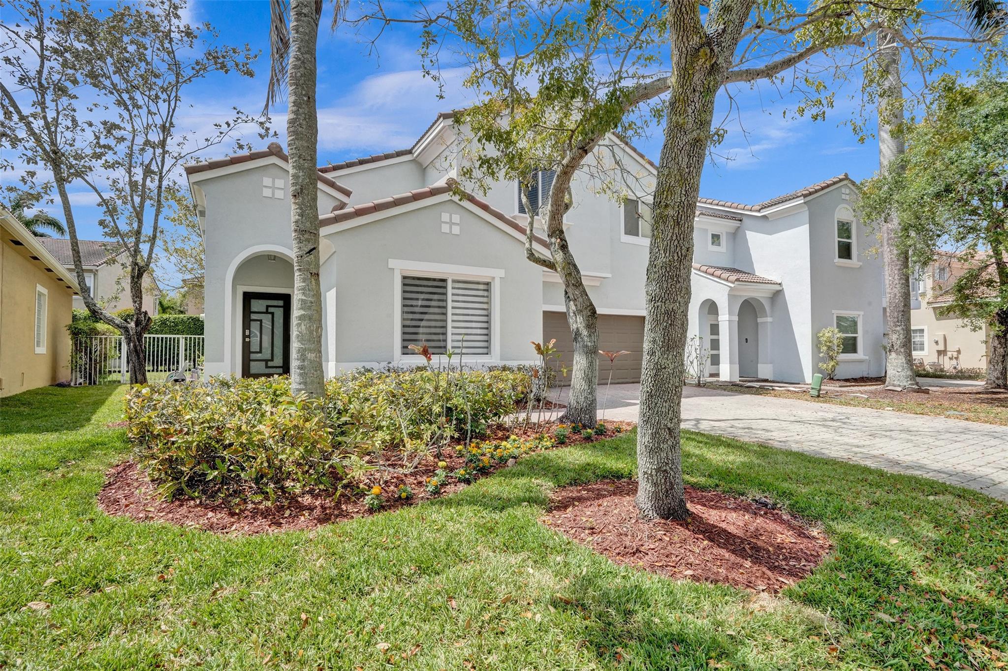 Beautiful 3 bedroom, 3 full bath, 2 car garage home in the desirable gated community of Vizcaya in Coral Springs with low HOA that includes lawn service, cable, alarm monitoring and amenities such as Clubhouse with fitness center, pool, hot tub and tennis courts! This home features an amazing floor plan with 1 bedroom and full bathroom downstairs and 2 master suites upstairs, FRESHLY PAINTED EXTERIOR, brand new IMPACT WINDOWS & DOORS, Updated kitchen with white wood cabinets, granite countertops and BRAND NEW STAINLESS STEEL APPLIANCES, tile floors in living area and brand new wood-look tile in downstairs bedroom, new vanity in downstairs bathroom, covered patio and fully fenced in backyard. Newer AC unit (5 years new). Excellent location, Great Schools, easy access to highway.