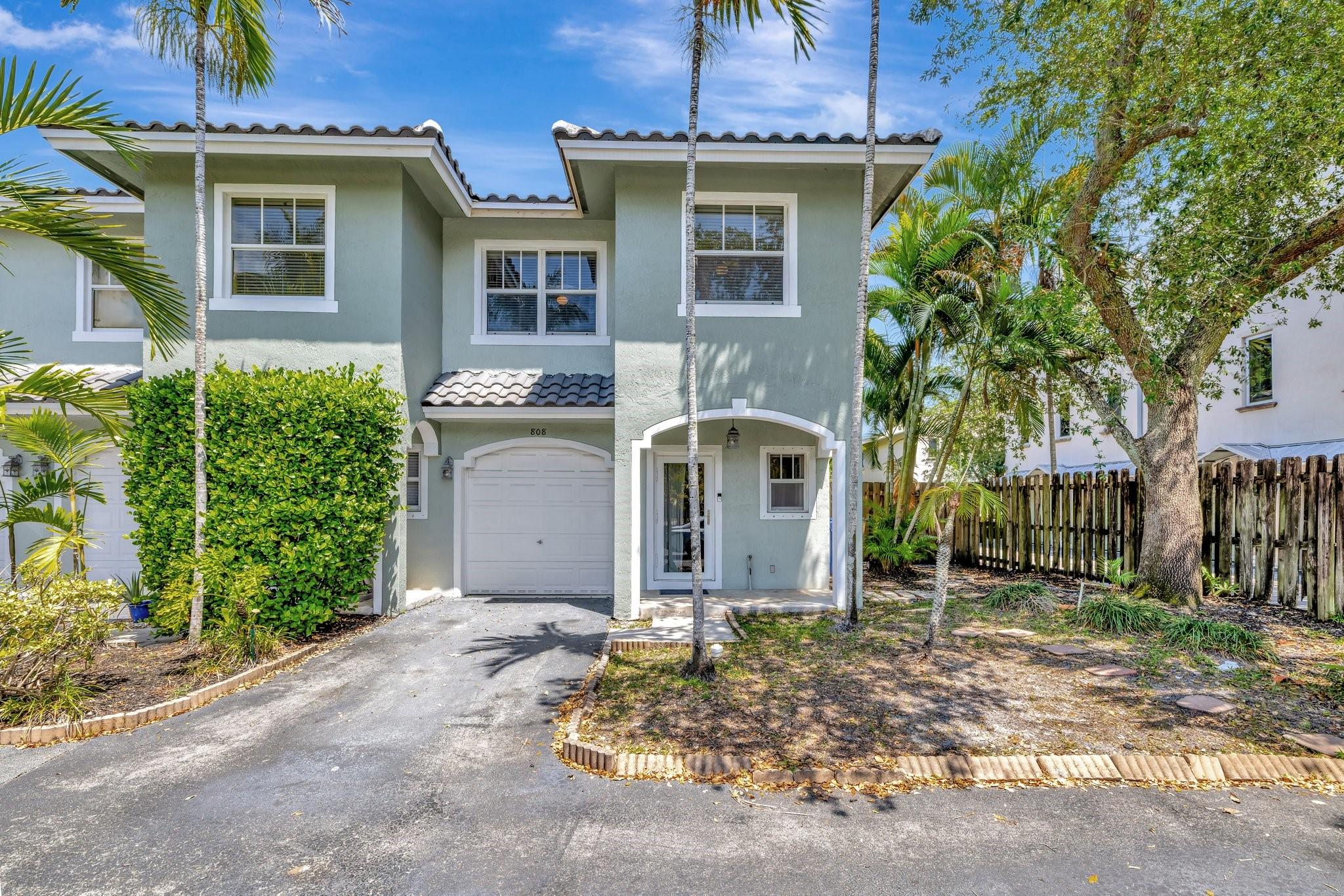 Smart & Stylish Corner Townhome in Gated Fort Lauderdale Community! This 3BD/2.5BA home features a 2023 roof, 2024 attic insulation, new dishwasher, Nest thermostat, Ring alarm, solar motion cameras, and Ethernet wiring throughout. Enjoy impact windows upstairs and shutters downstairs for storm protection. The spacious primary suite includes a walk-in closet and Roman tub. Highlights include stainless steel appliances, crown molding, a private fenced yard, and Wi-Fi garage opener. Located minutes from downtown, beaches, airport, and major highways—this is modern living at its best!!!