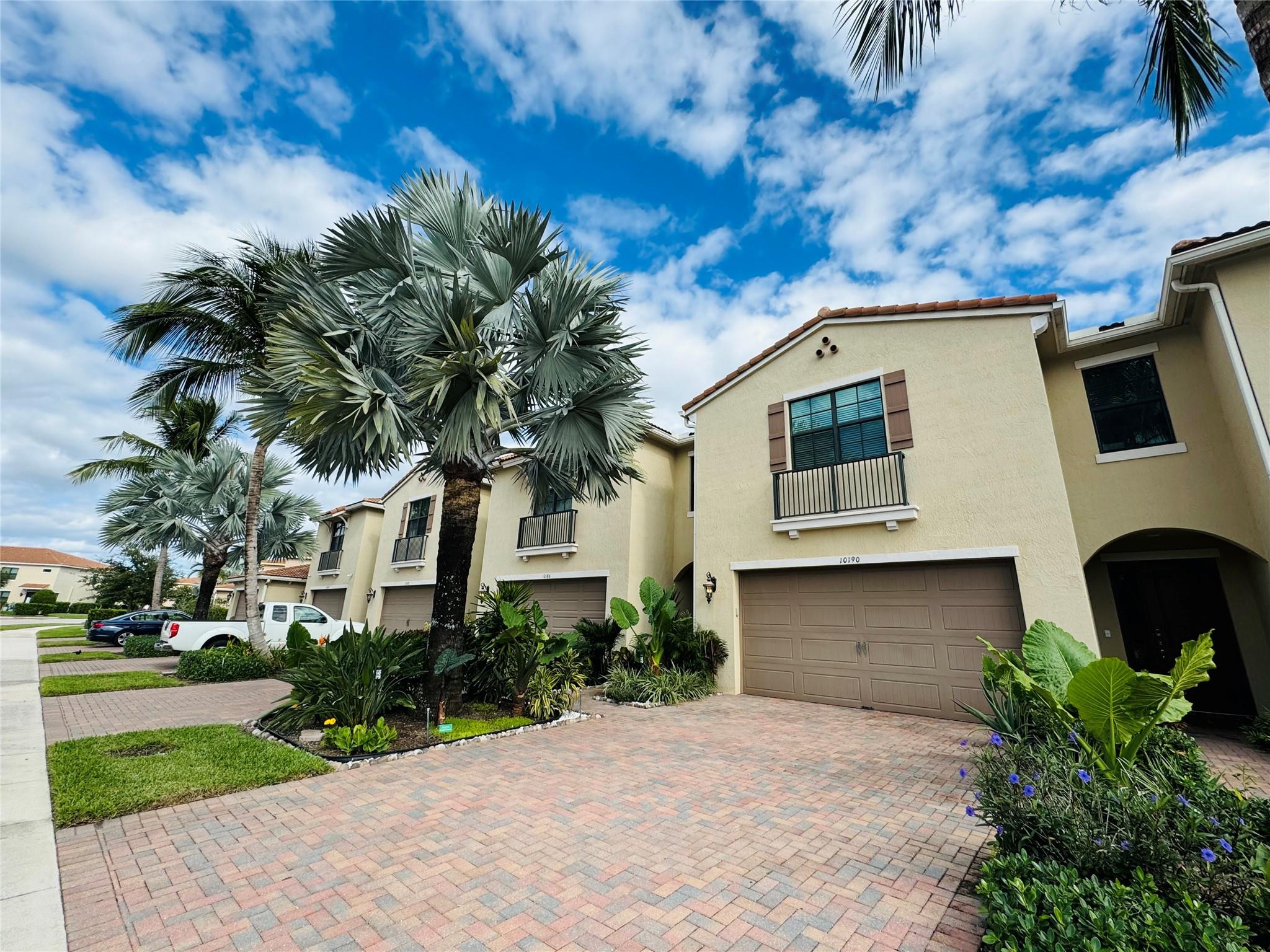 Priced to SELL! Just MOVE IN! Luxury FULLY UPGRADED 2,131SQq Ft, 3 br and 2.5 bathrooms, 2 car garage townhome with covered patio with rare garden, lake, golf course  view, private, shade in PM. Foyer with marble/stone wall leads to large white glossy Chef's Kitchen with GE Profile appliances, double oven, counter-depth refrigerator, all like NEW, midnight sparkle quartz counter island, porcelain tiles, custom vinyl staircase and flooring upstairs, fully painted with SW Duration Satin, high ceilings, brand new oversized built in closets, sparkle quartz bathrooms counters, MOEN faucets, upgraded hardware, frameless shower. Impact windows and doors, low insurance. Resort style amenities, heated pool and spa, fitness, pool table. Investors friendly, rent day 1, A+ Schools, 2 pets any size.